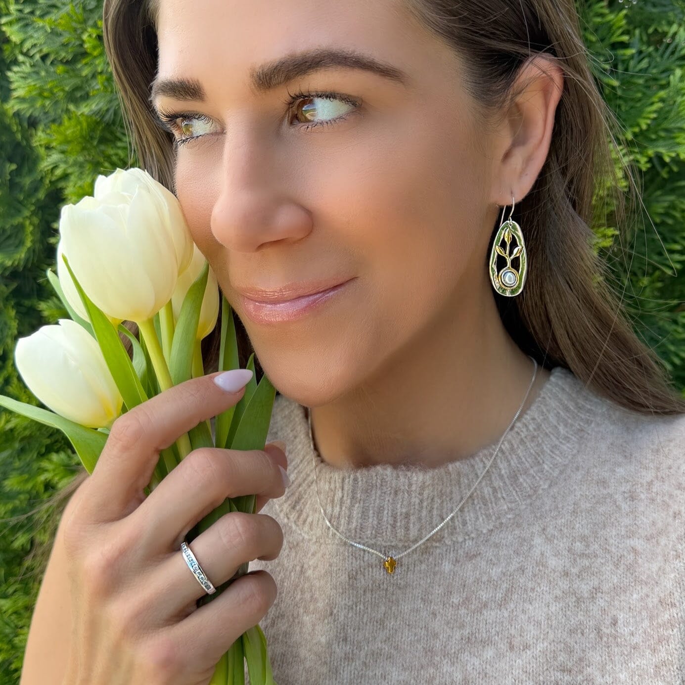 gold-plated and silver earrings featuring a small pearl