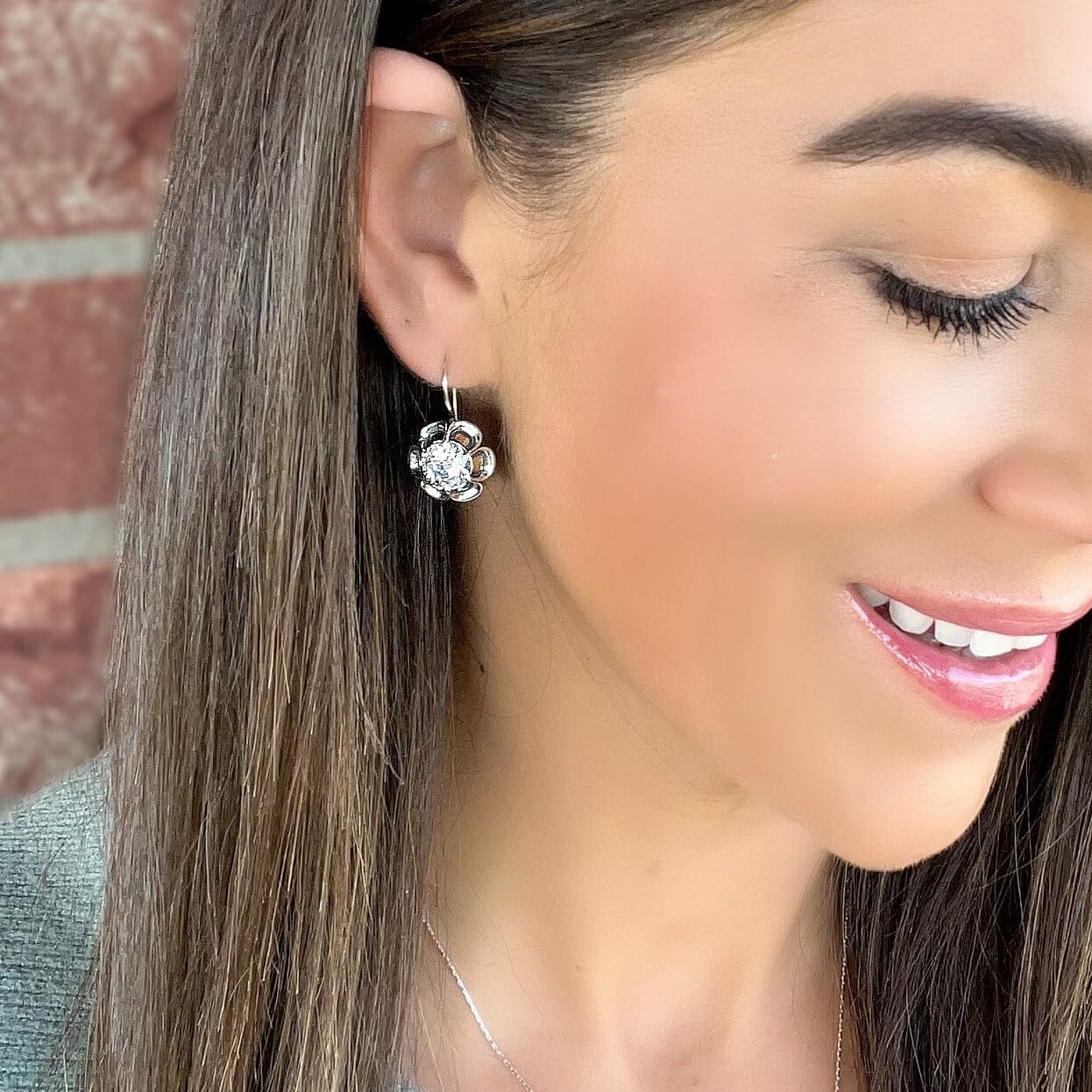 silver secured back flower earrings with cz center