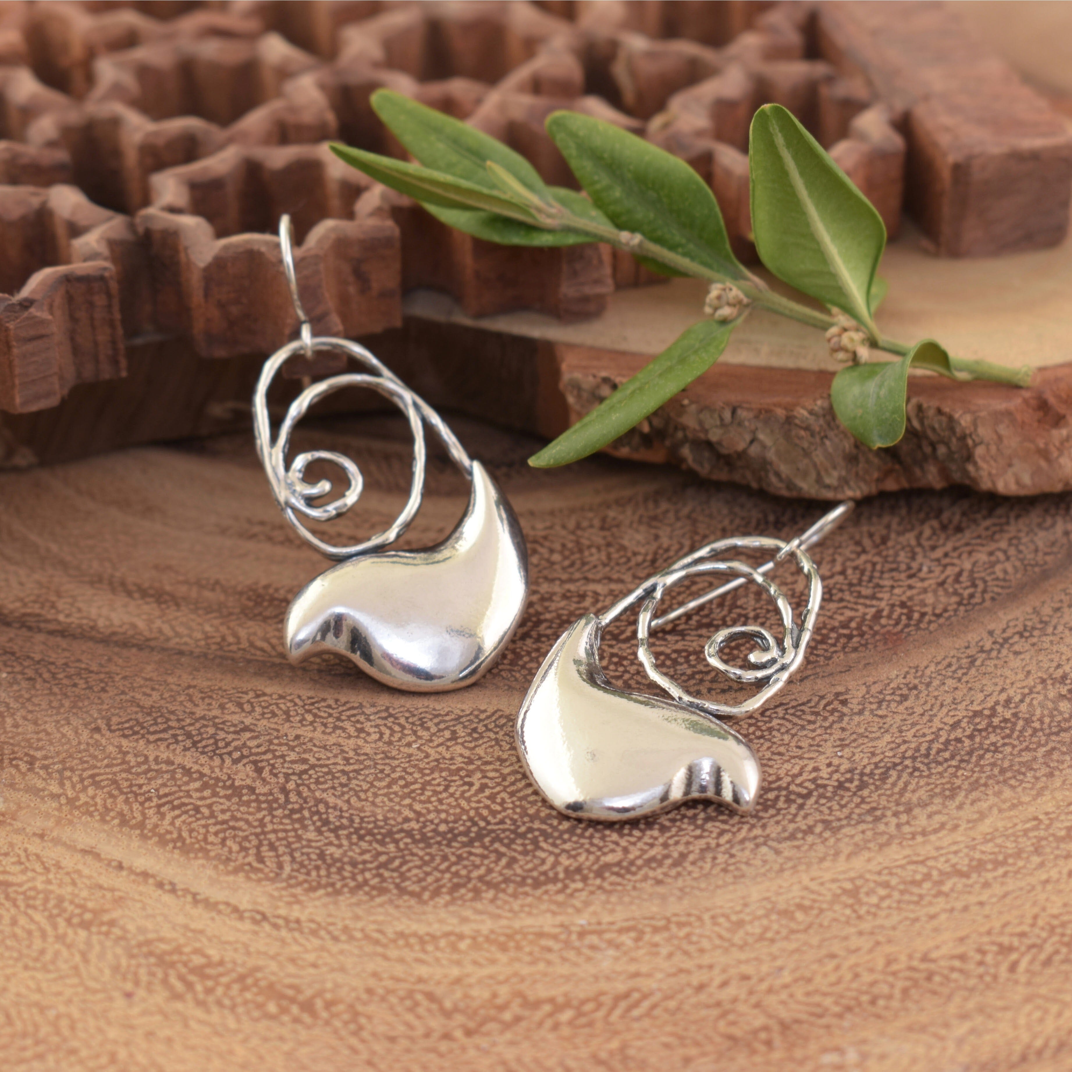 swirl designed bird earrings