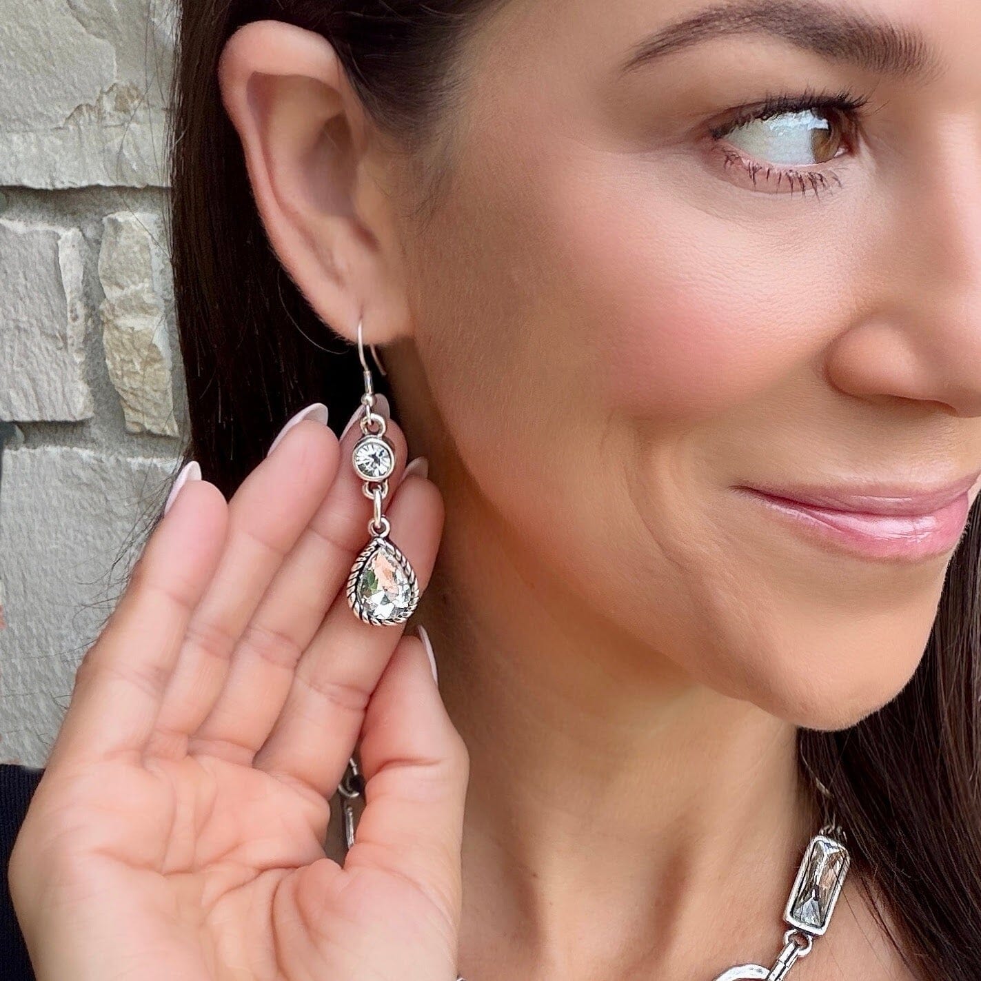 silver plated statement earrings featuring clear crystal stones