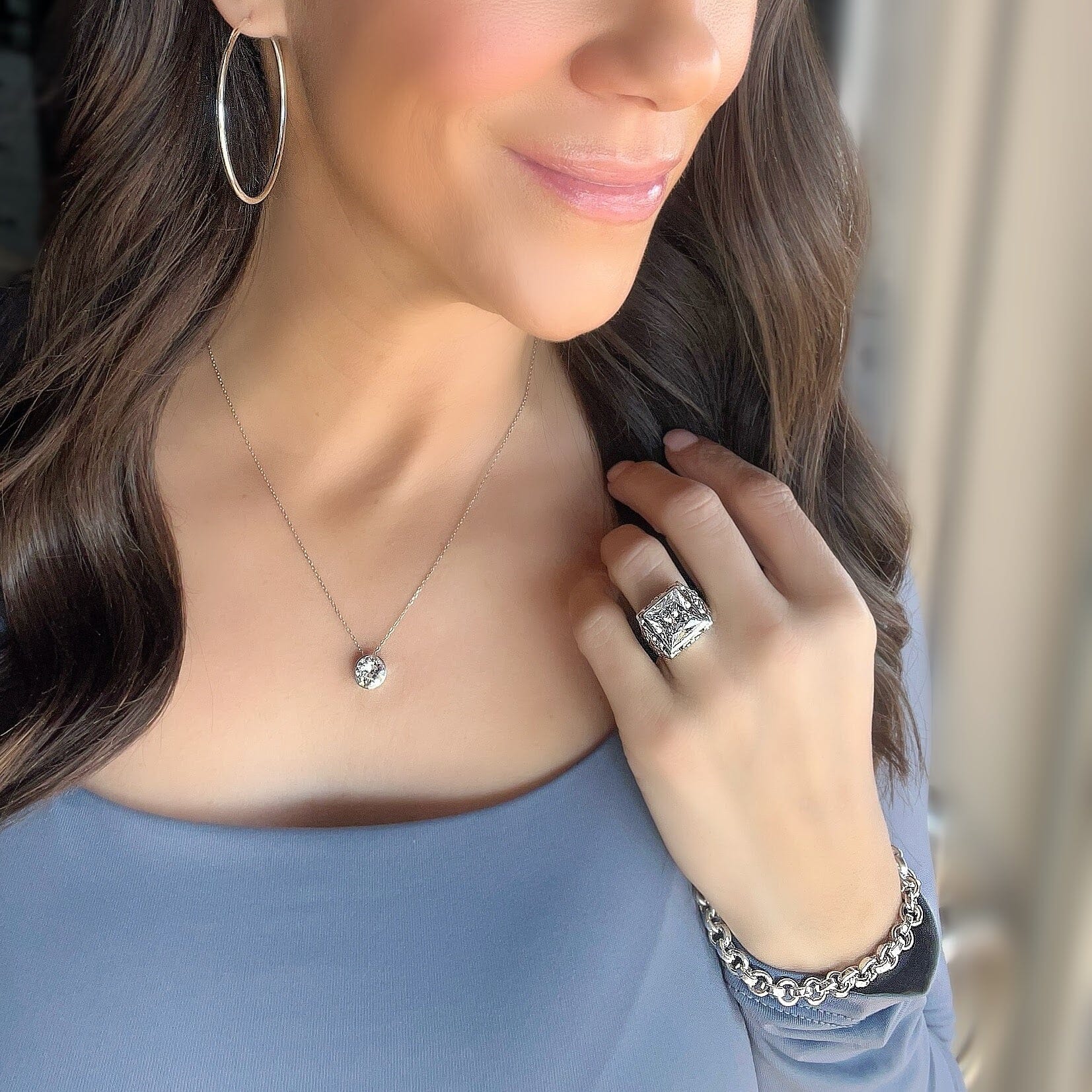 sterling silver necklace featuring a cz stone paired with simply the best hoops and simply sumptuous and Bonita bracelet