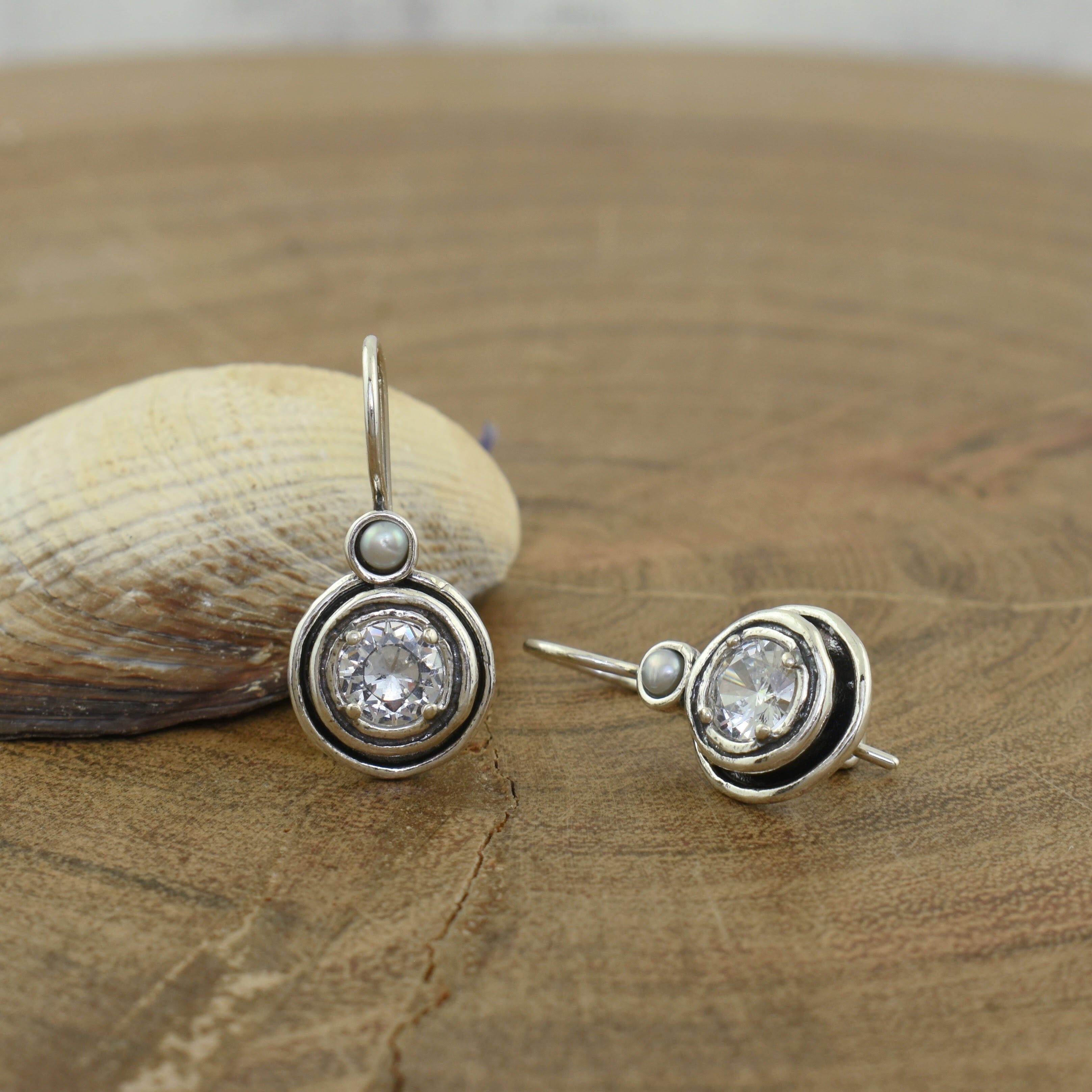 Sterling silver earrings featuring CZ and freshwater pearl
