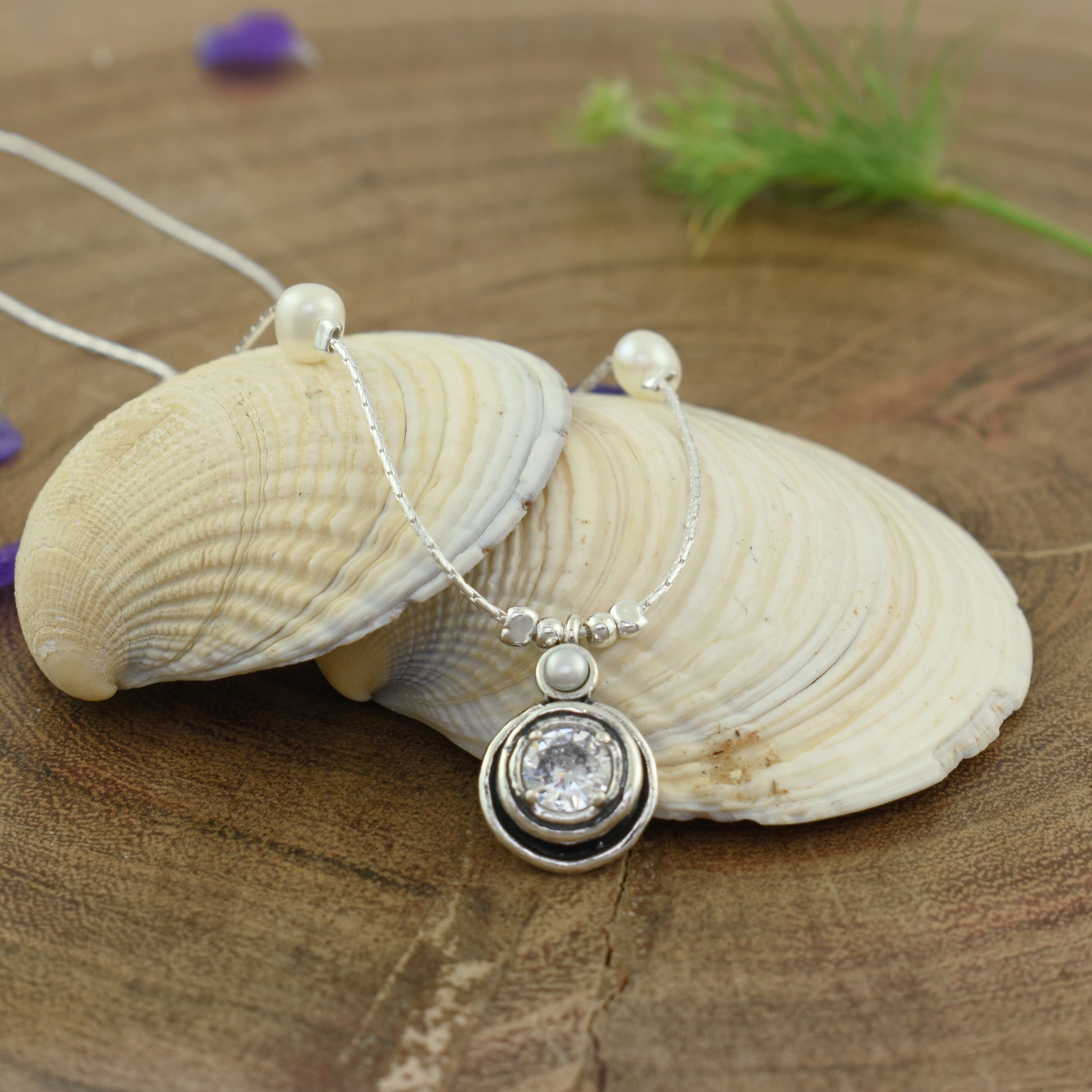 Sterling silver necklace featuring CZ and freshwater pearl