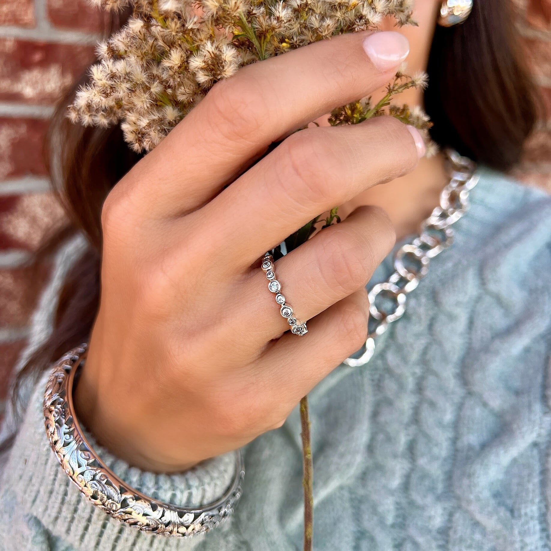 thin sterling silver band featuring round cz stones