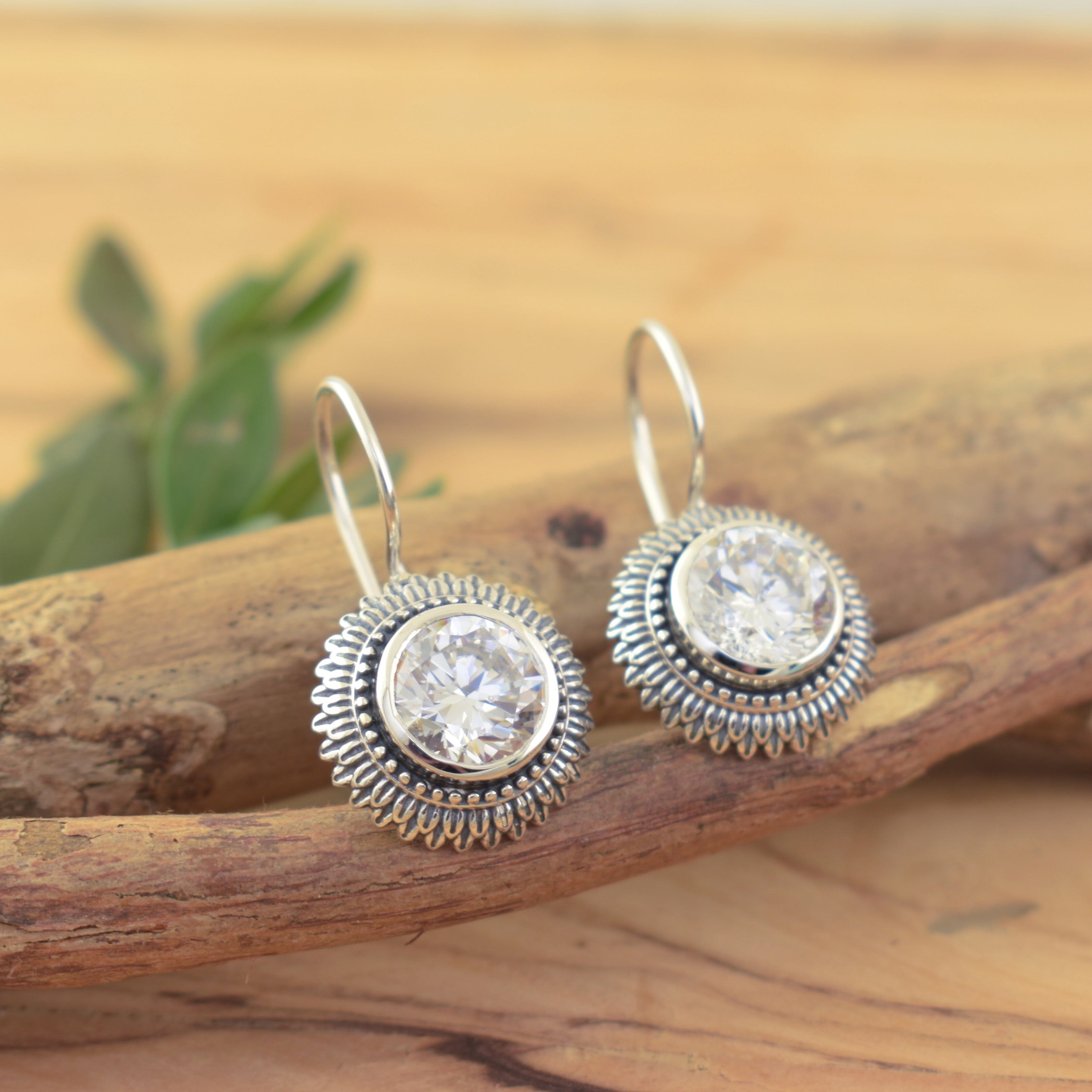 sterling silver hook back earrings with a round clear cz stone in the center