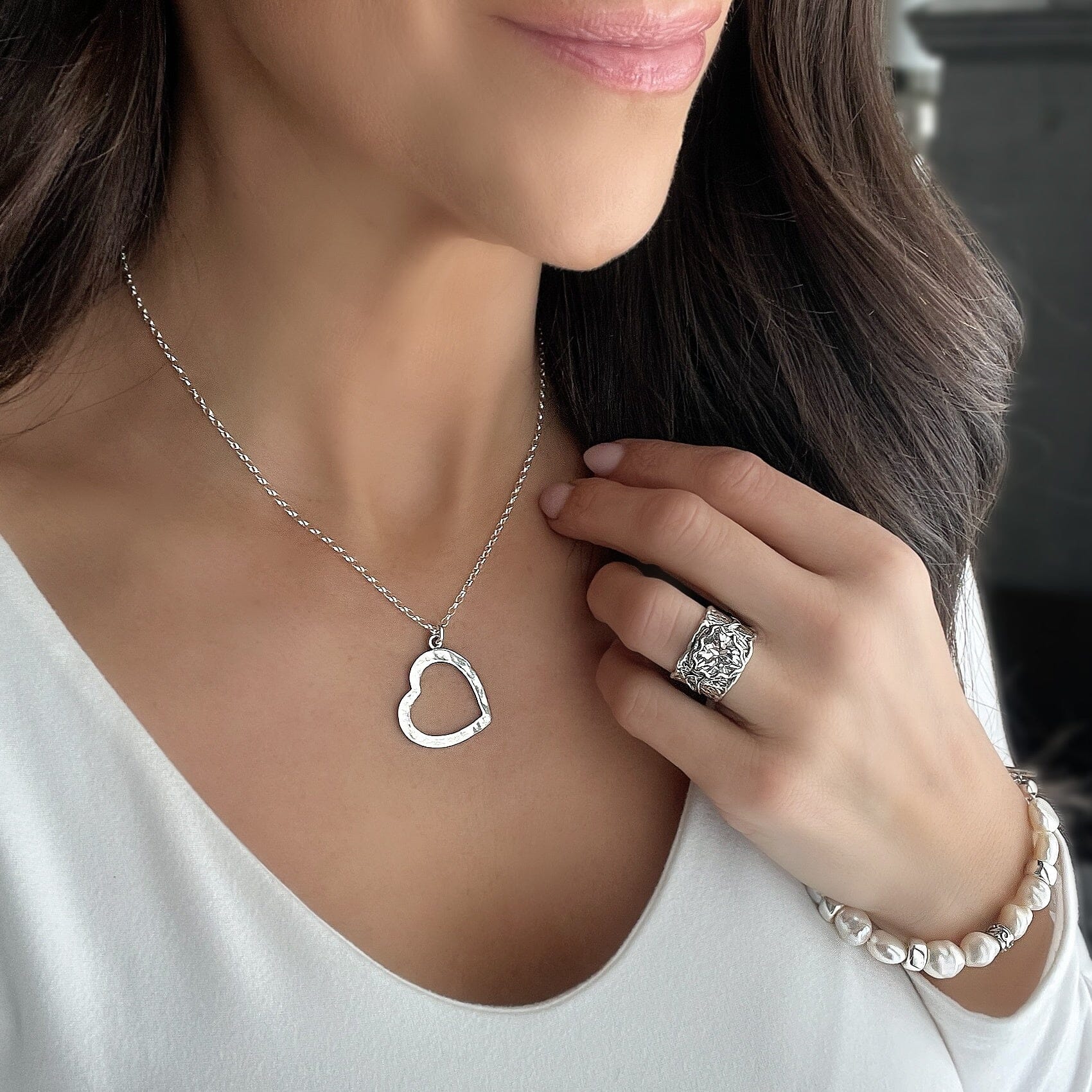 sterling silver open heart necklace with a hammered finish