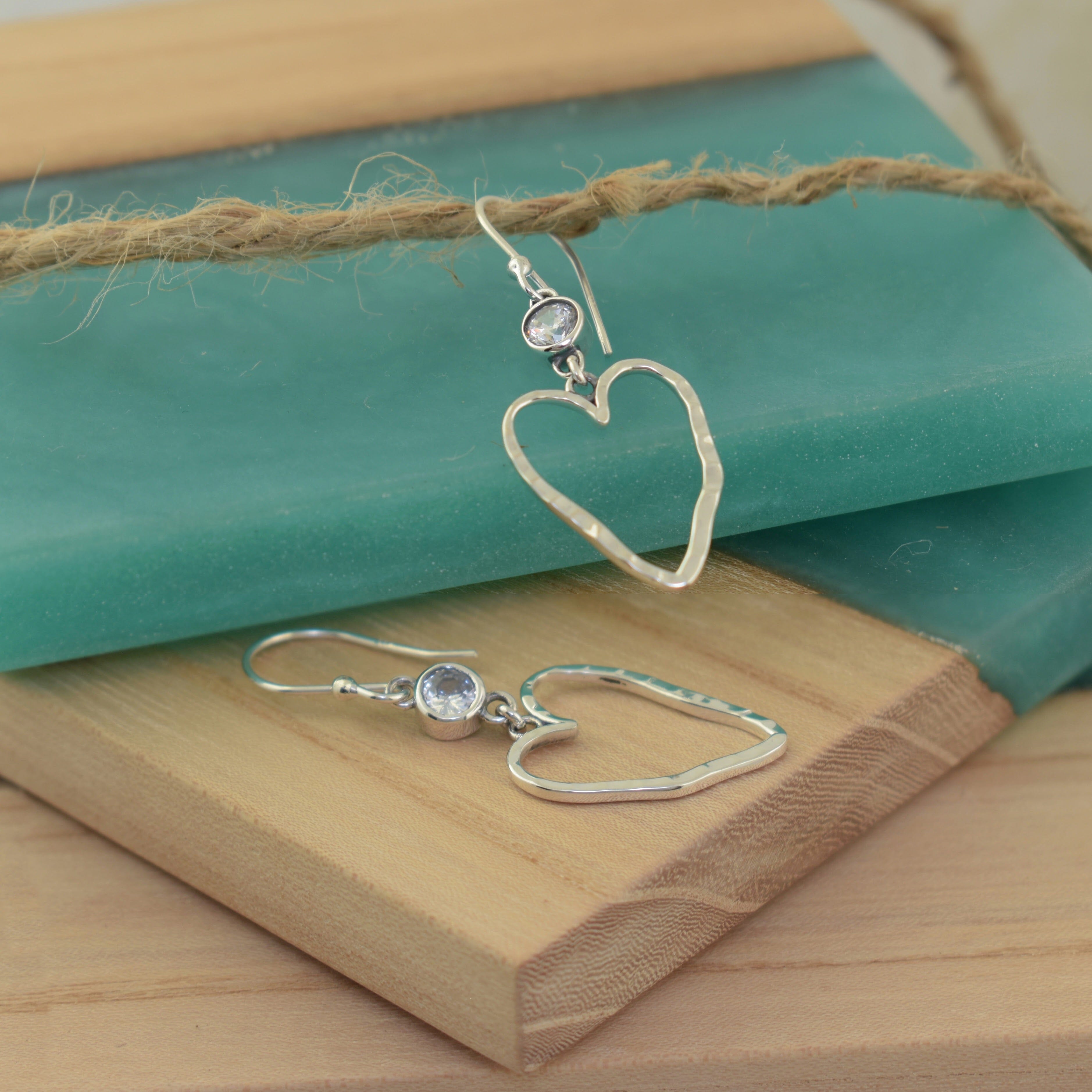 sterling silver perfectly imperfect heart earrings with a CZ stone