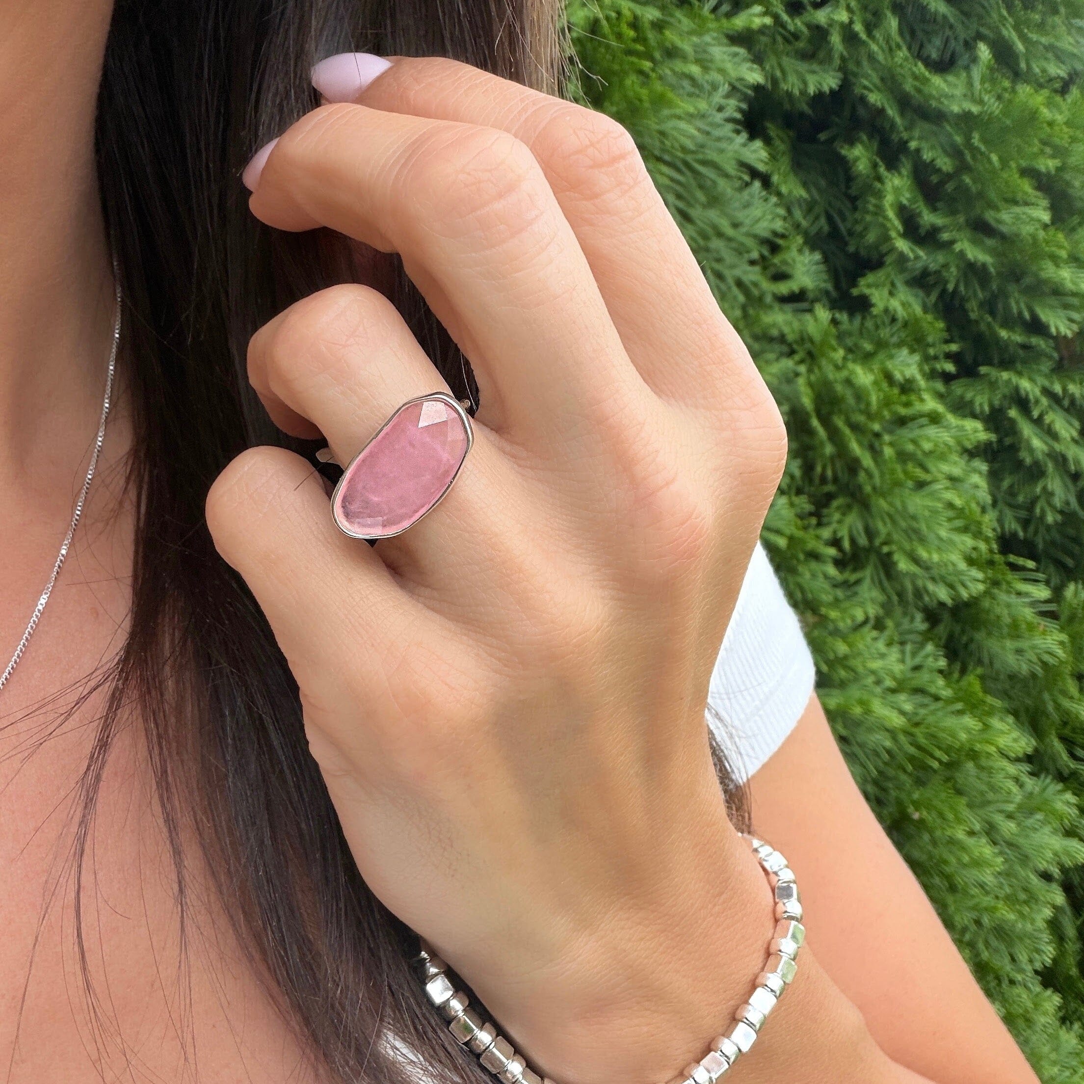 high polished silver ring featuring a faceted pink quartz stone