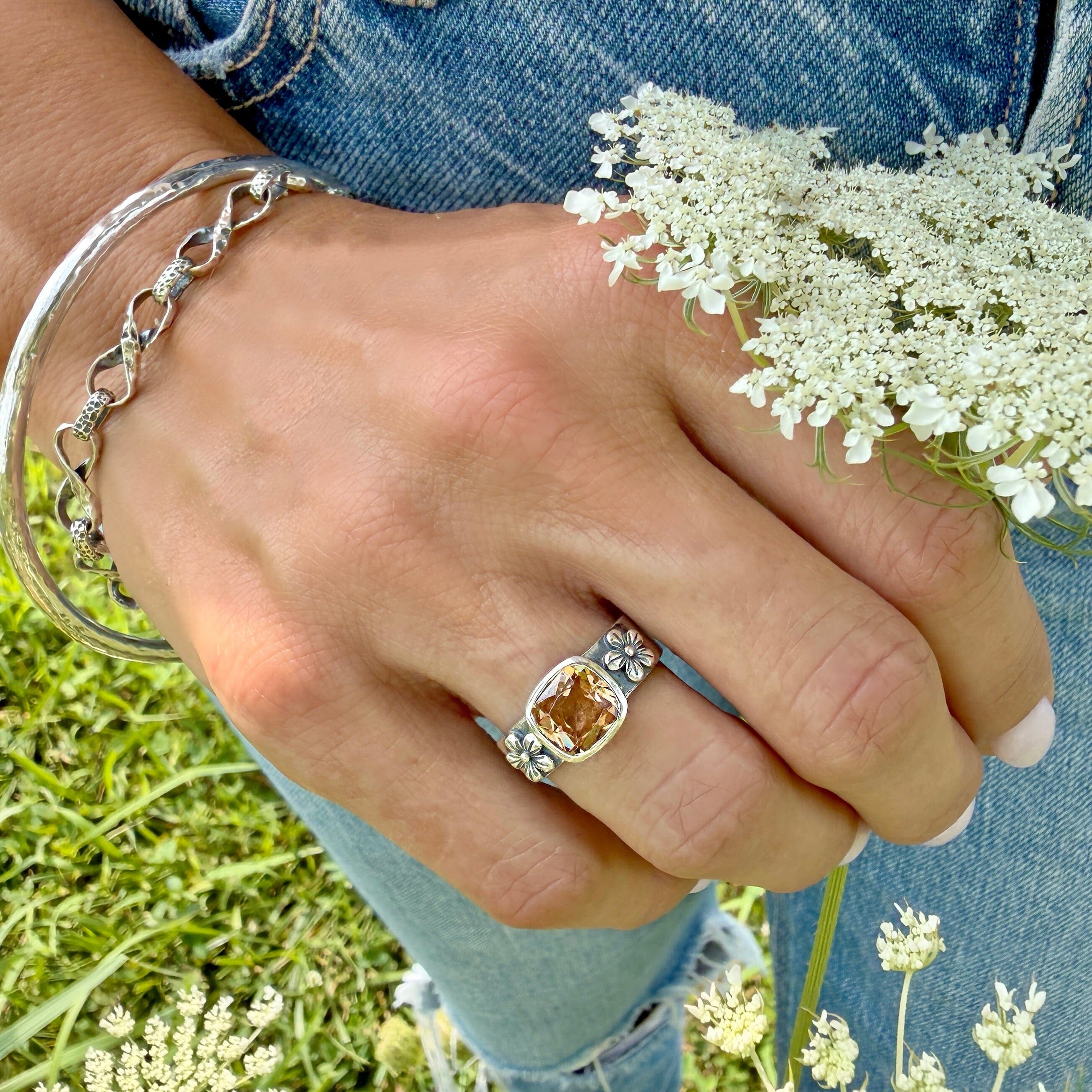 faceted honey colored cz bezel set in a floral ring