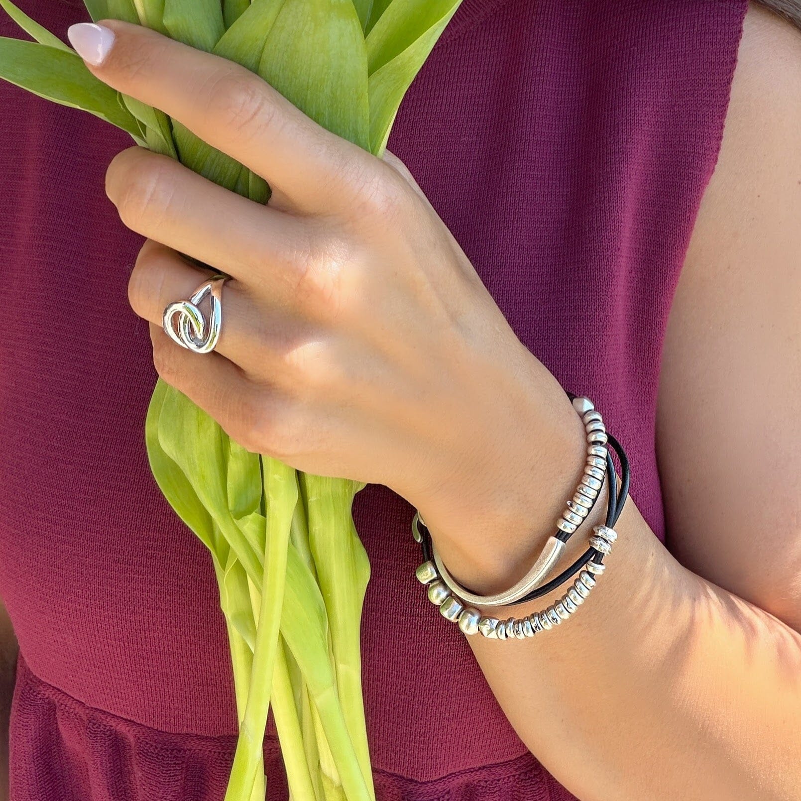 silver zamak wrap bracelet featuring leather