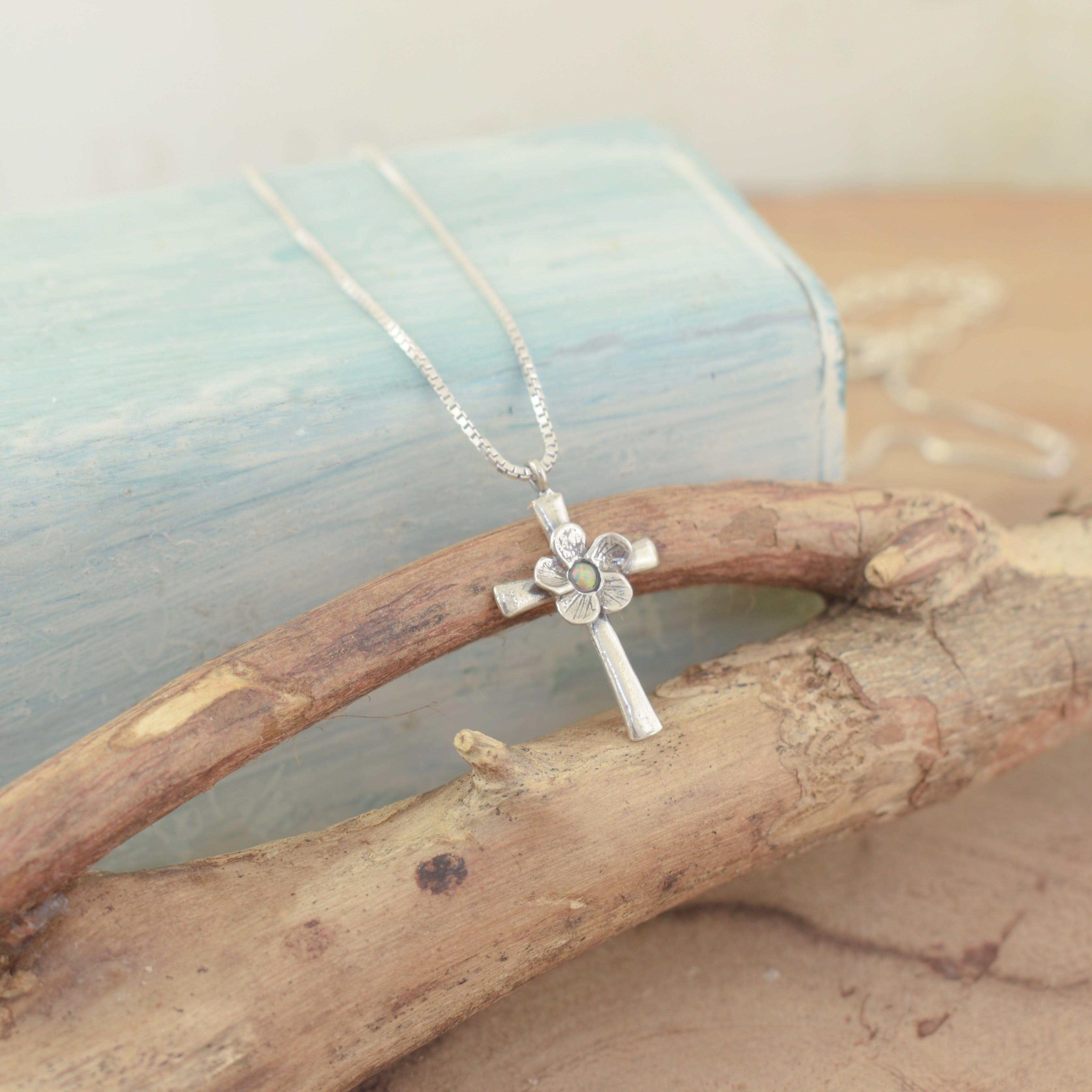 High polished and oxidized cross necklace with a flower and a Synthetic Opal in the center
