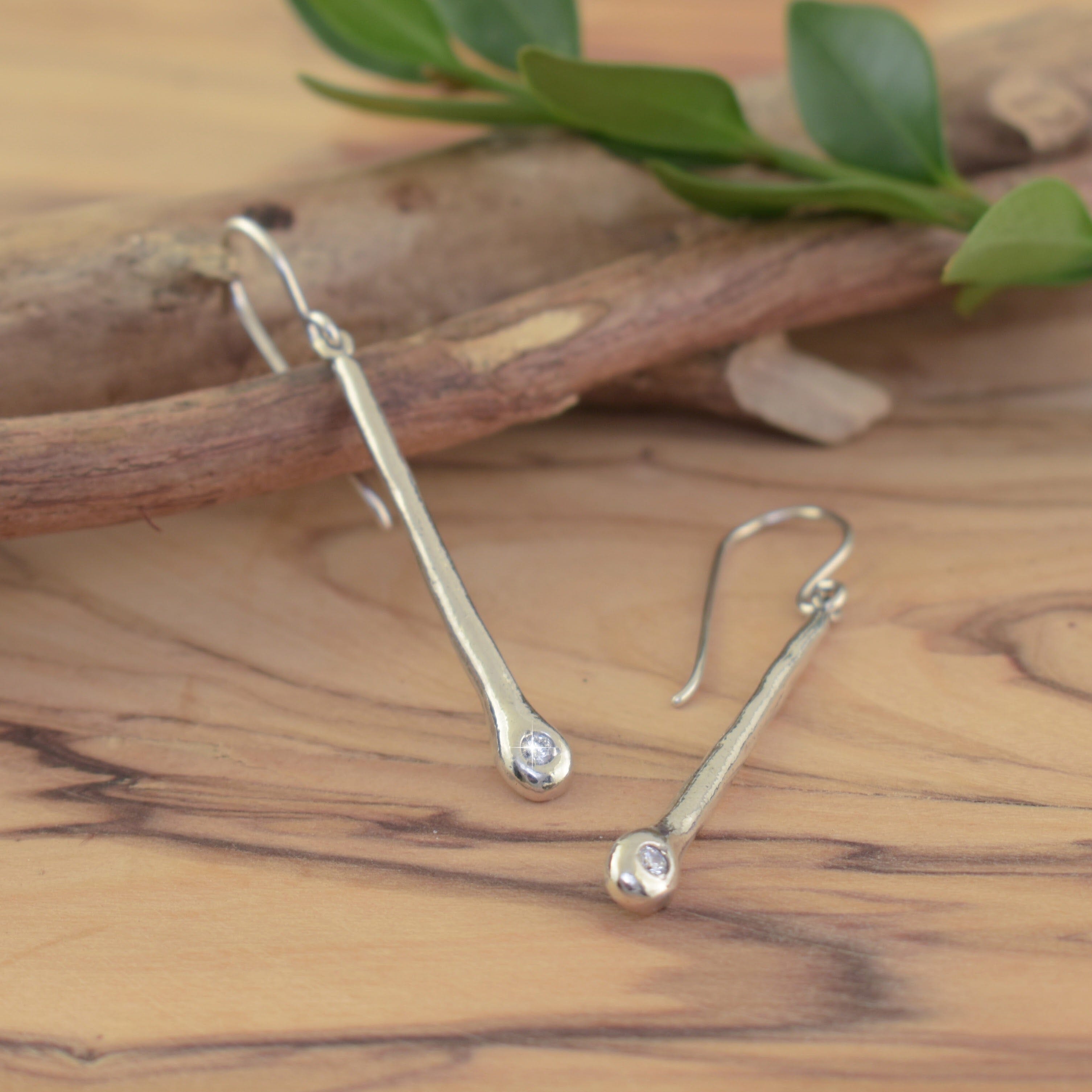 dangle earrings with a clear cz stone
