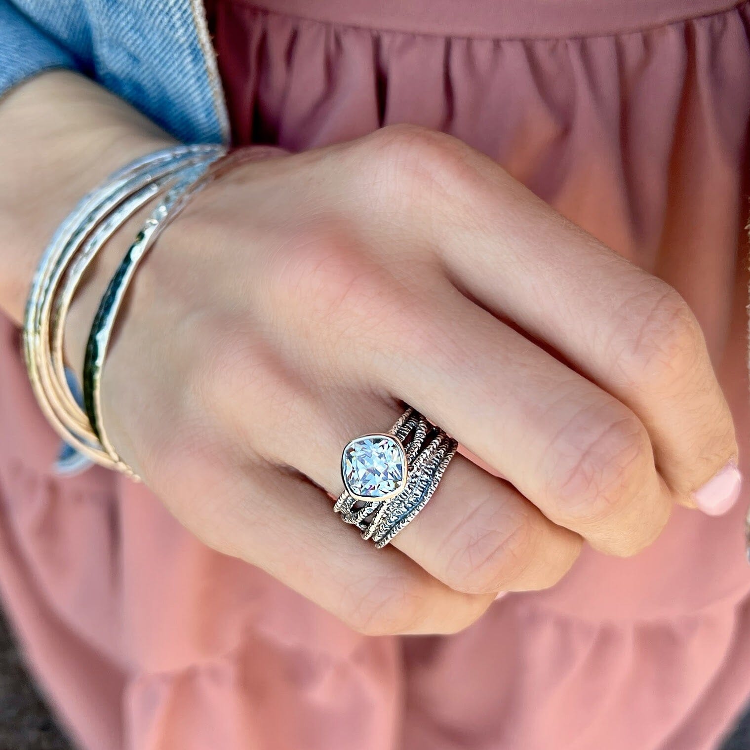 chunky silver ring featuring square-shaped cushion-cut cubic zirconia