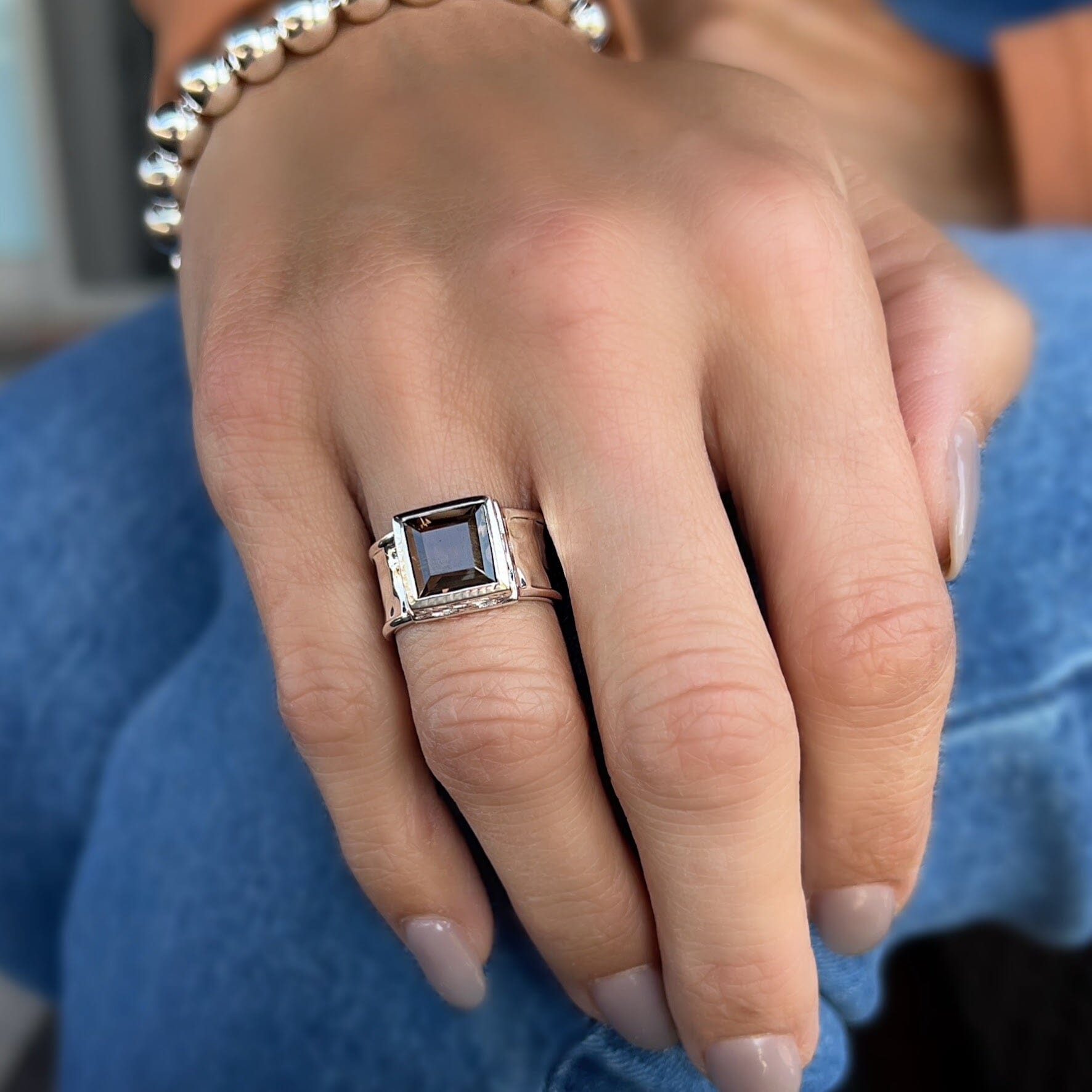 Iced Mocha Ring featuring a square smoky quartz stone with a wide hammered band