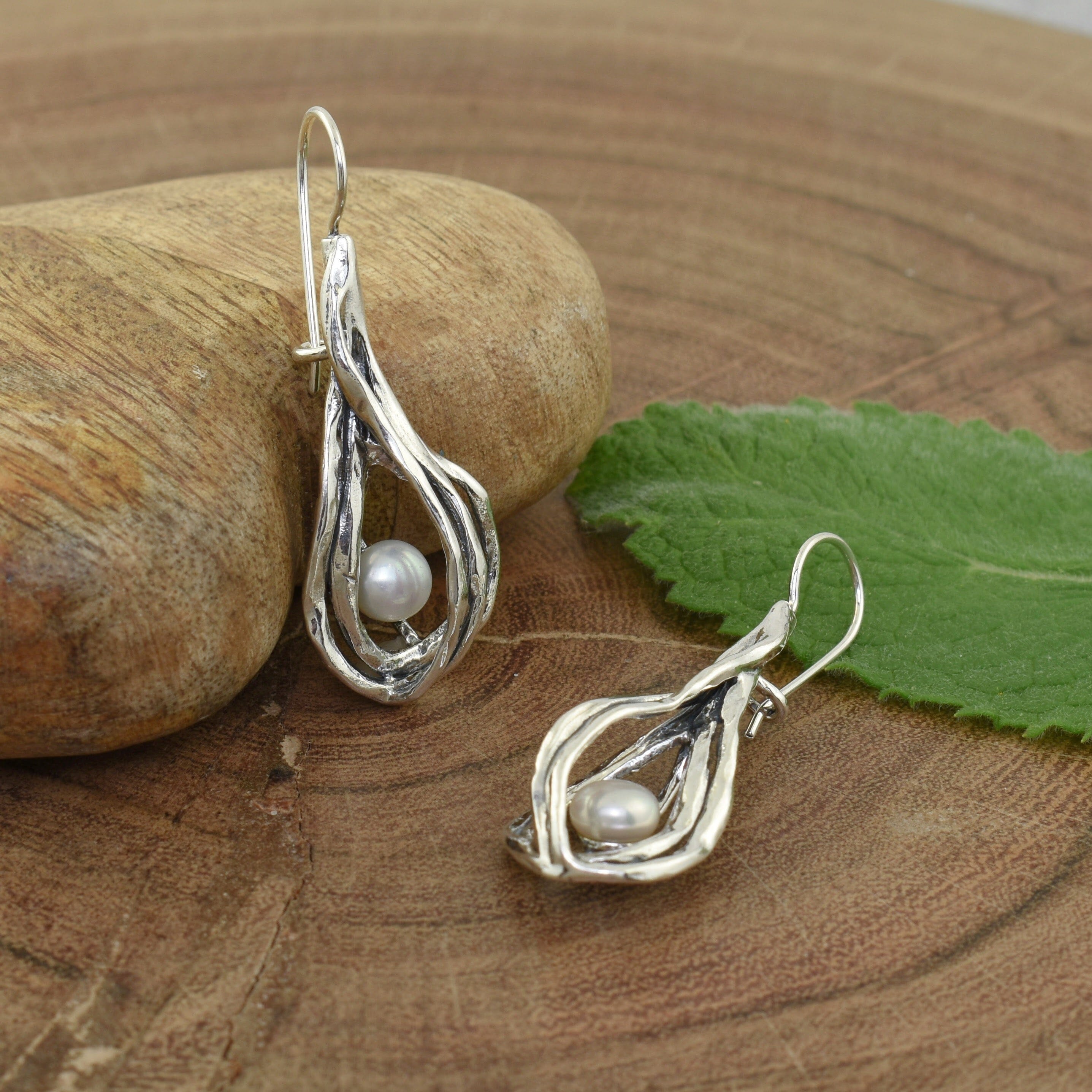 Handcrafted sterling silver and freshwater pearl earrings on Secure French Backs