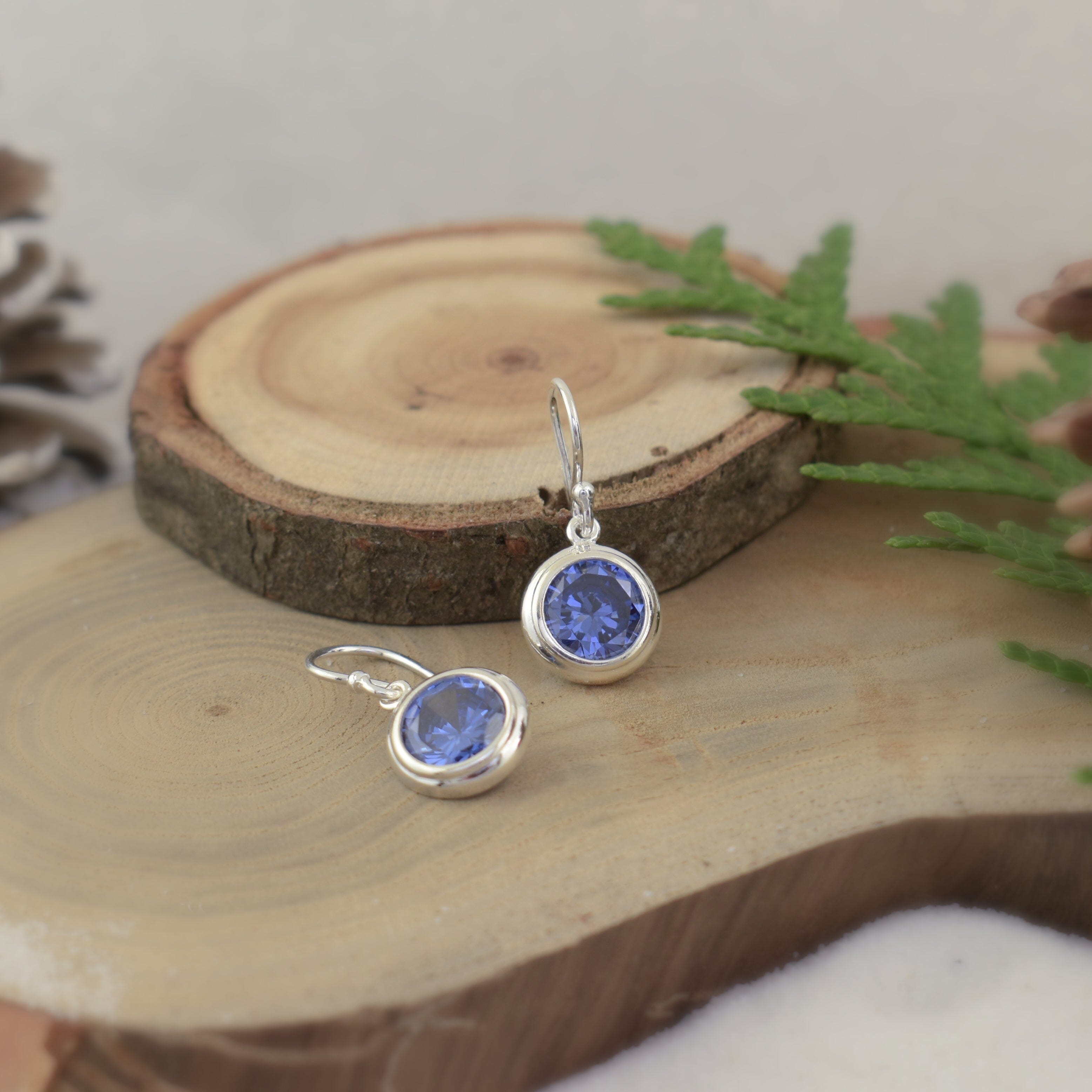 Handcrafted sterling silver earrrings featuring Tanzanite Blue CZ stones