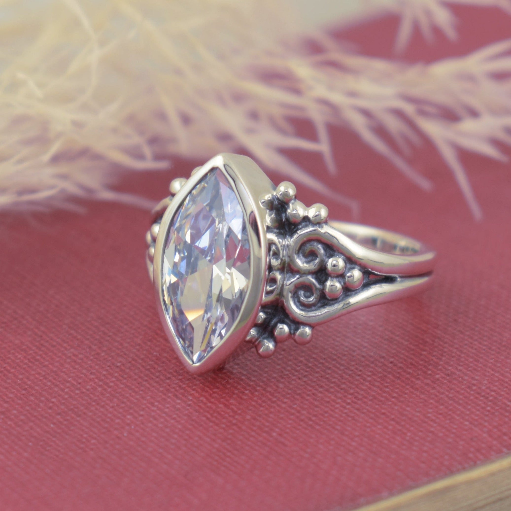 silver designer ring bezel set with marquise cz with beaded details