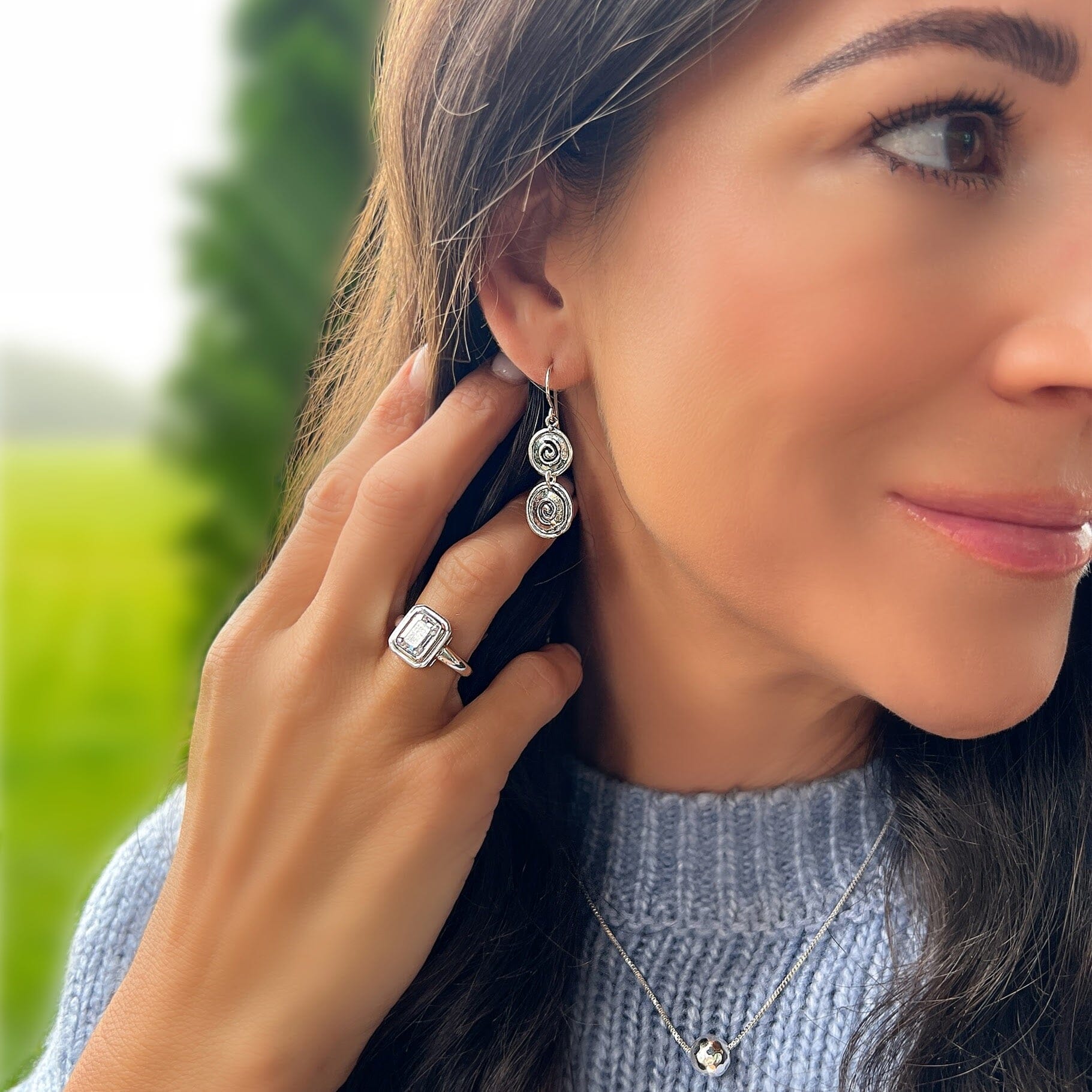 Designer silver swirl earrings