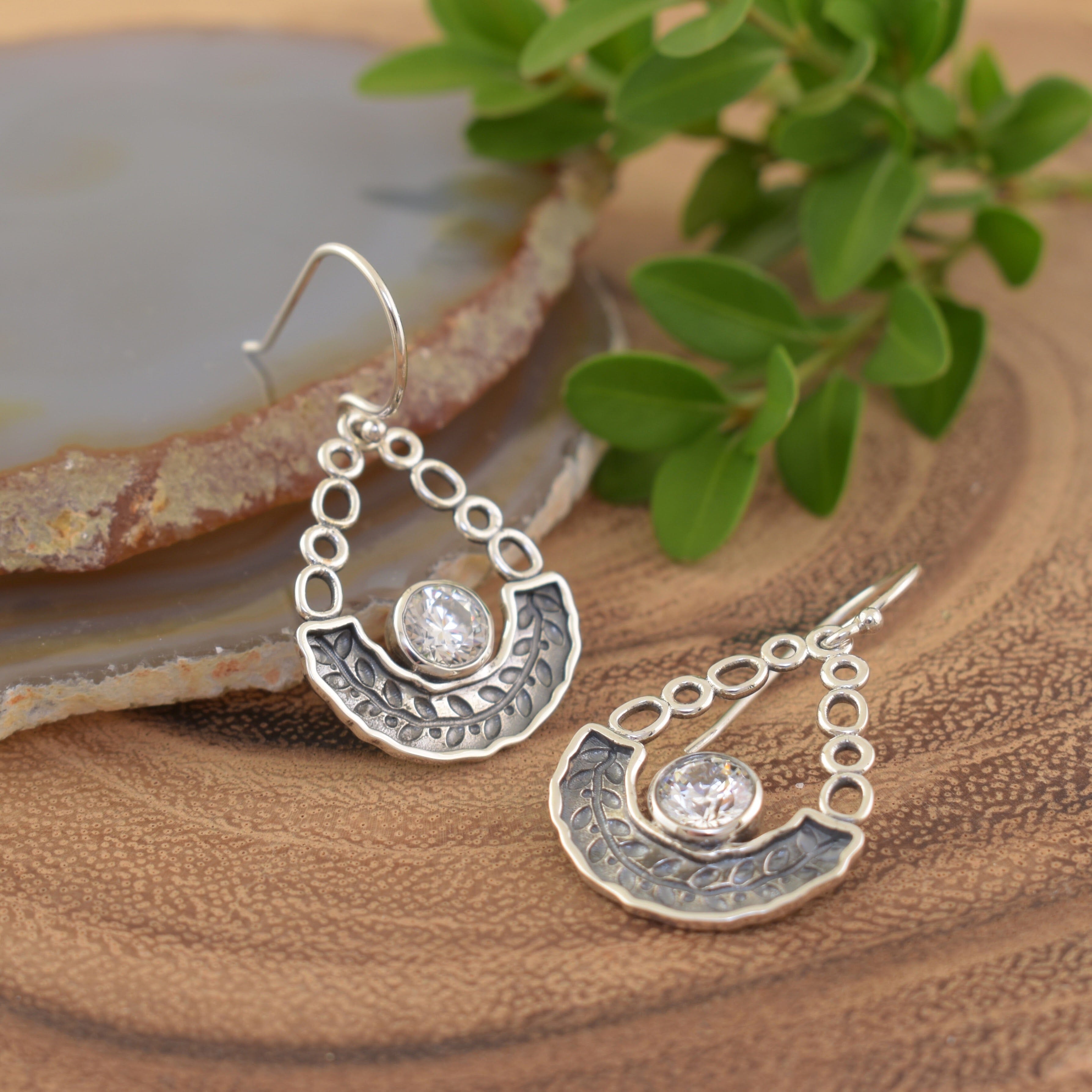 Stamped vine with a bezel set CZ stone in the center