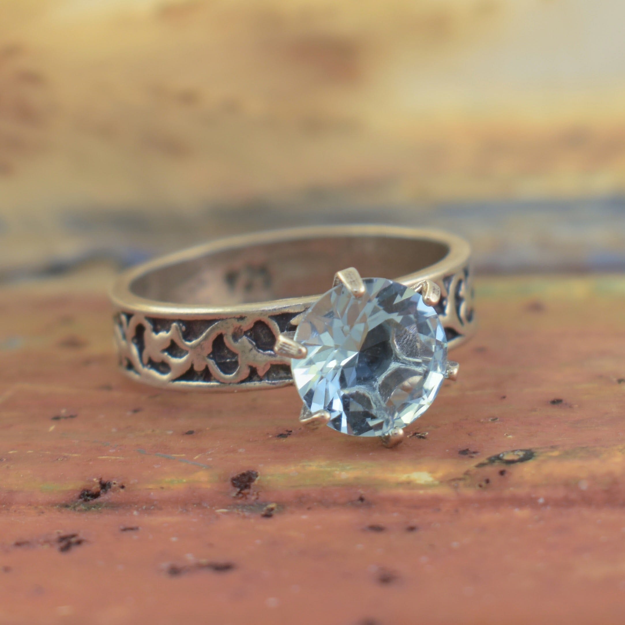 light blue ring with a small detailed band