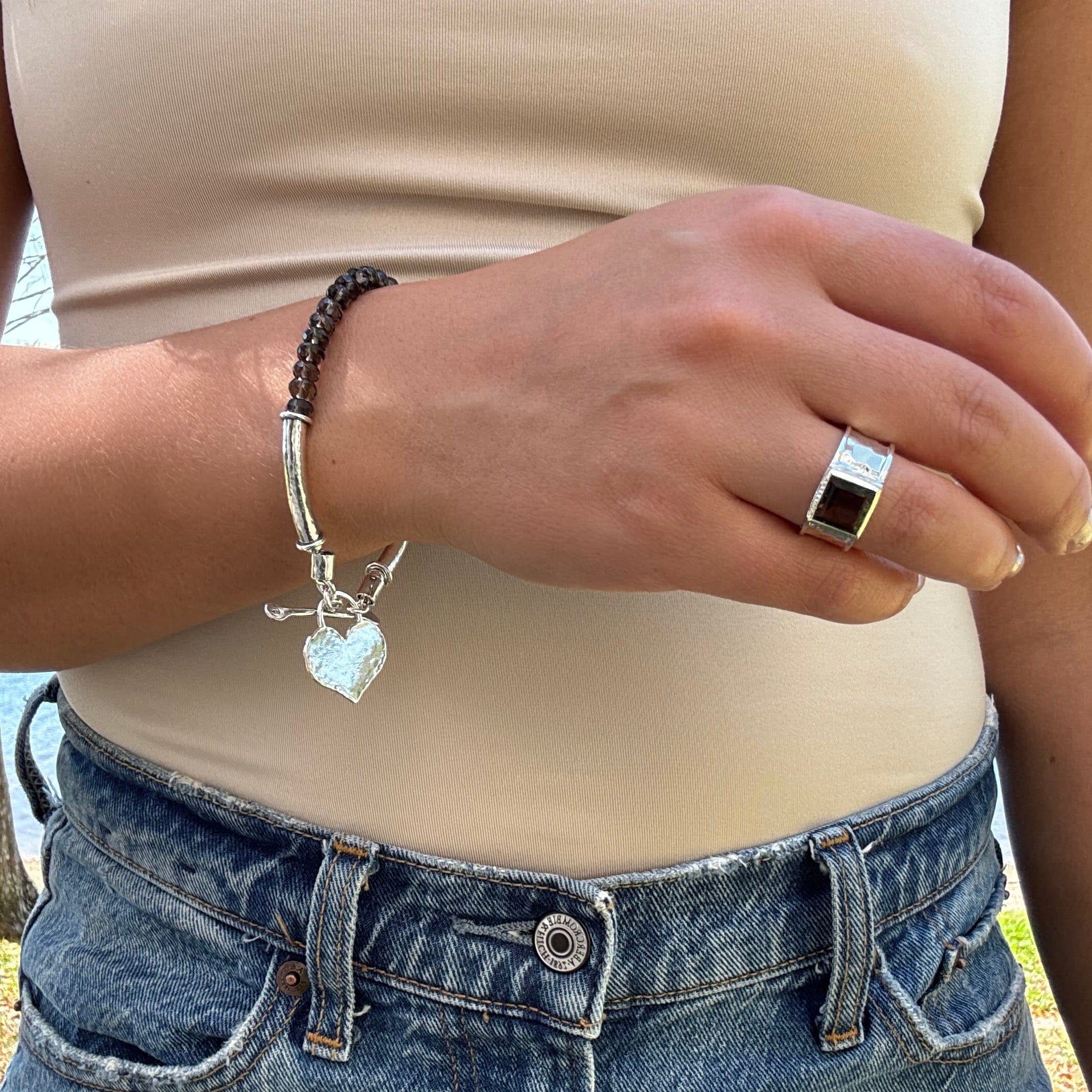 smoky quartz gemstone bracelet featuring a sterling silver toggle closure heart dangle