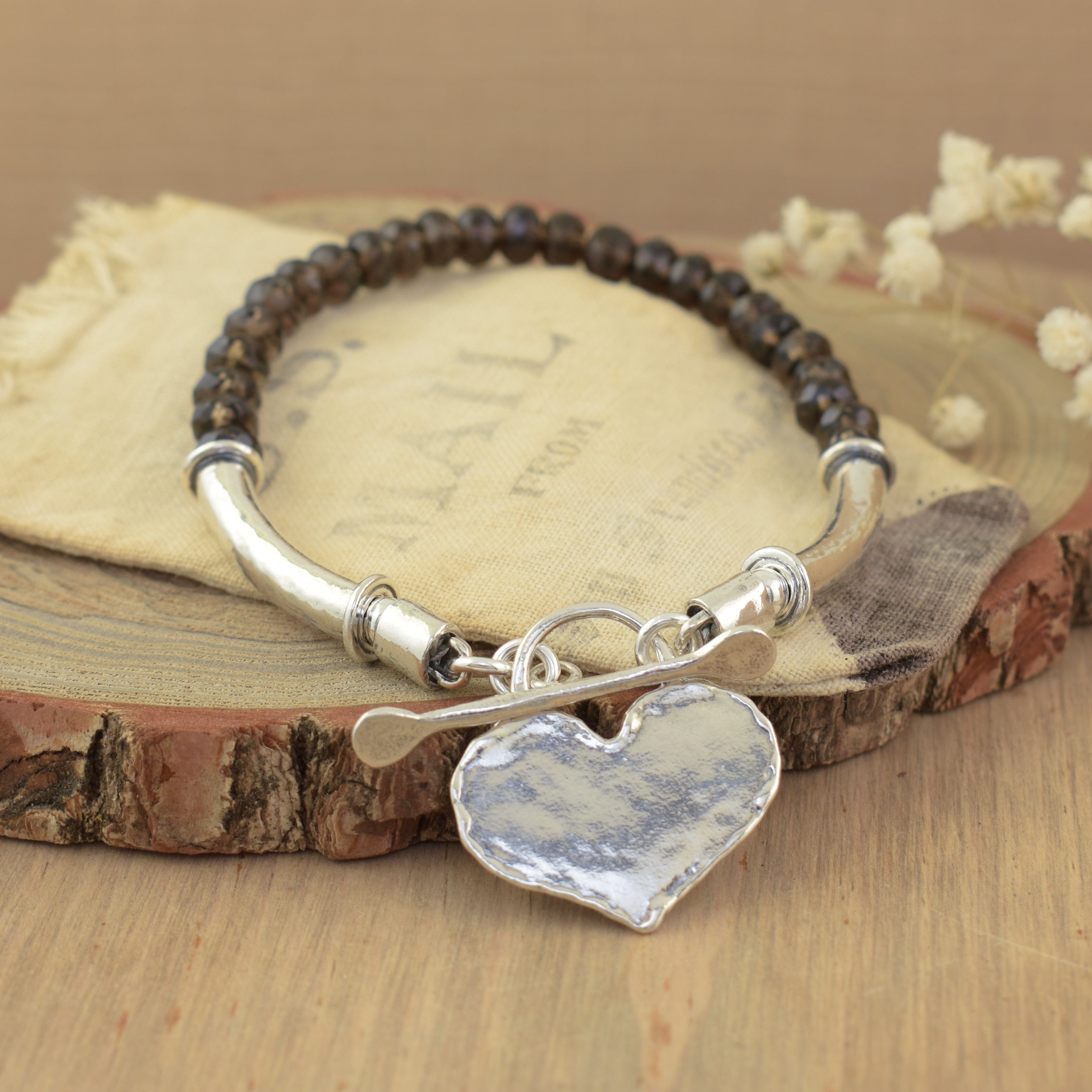 .925 sterling silver toggle-style bracelet with smoky quartz brown stones and heart pendant