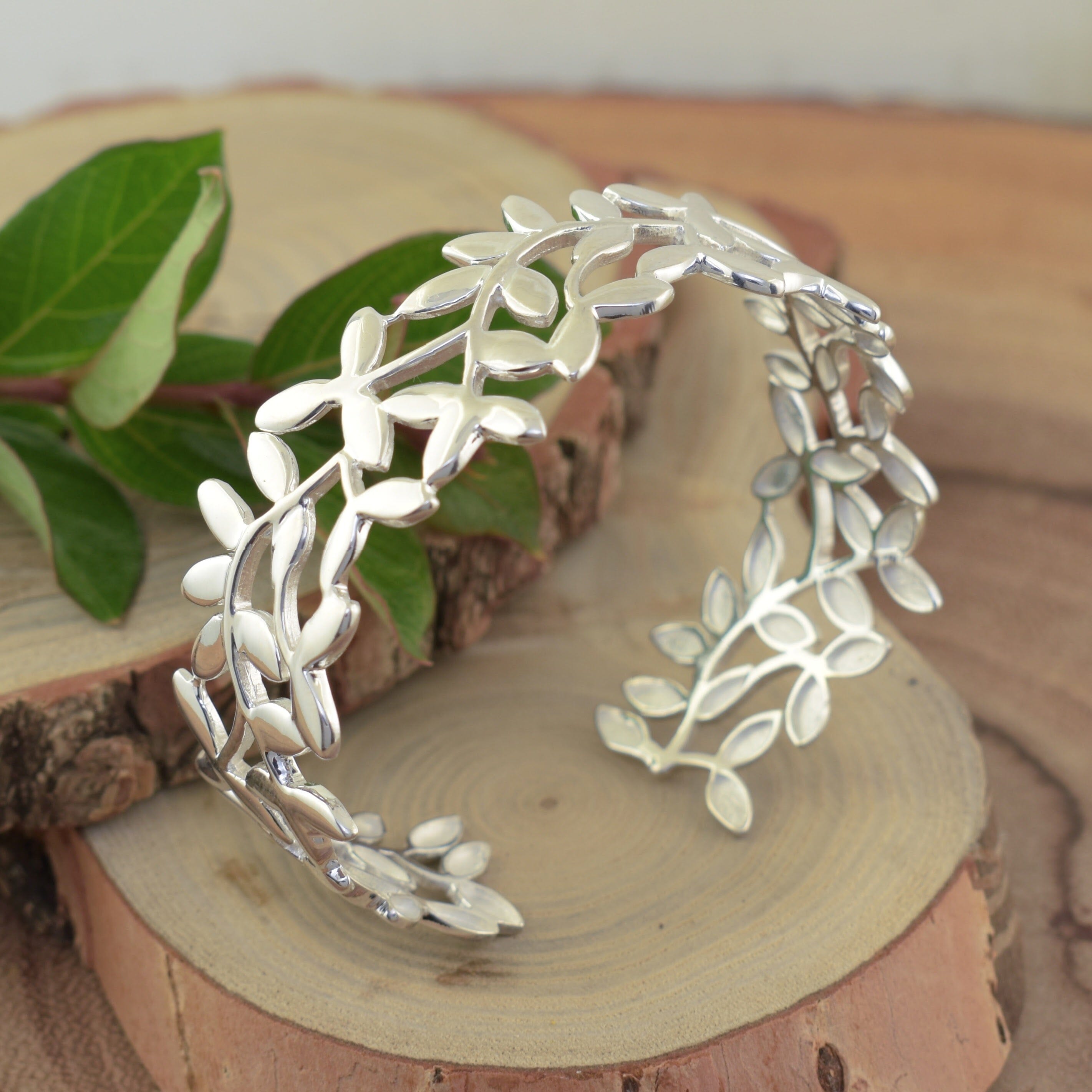 handcrafted, high polished leaf designed cuff