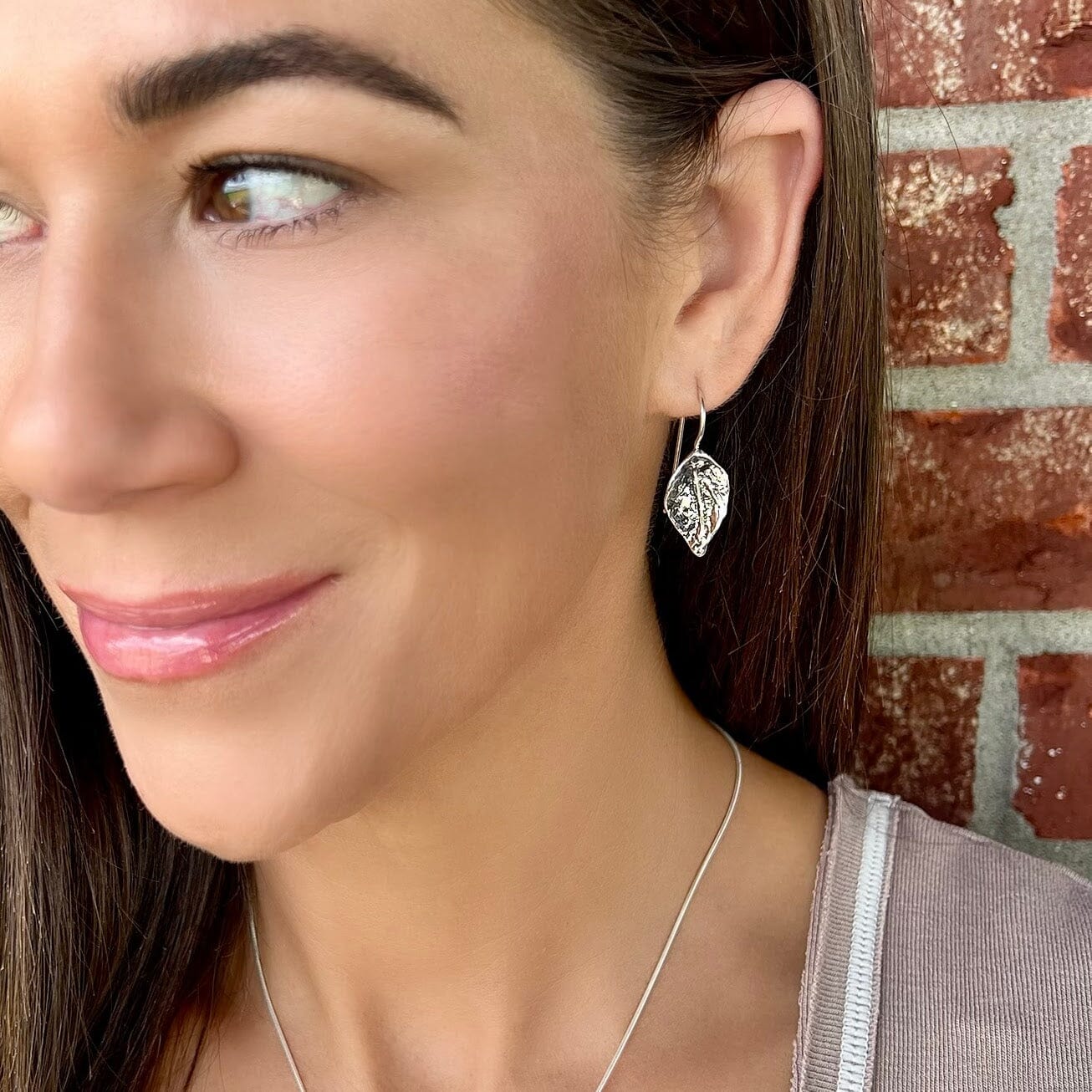 sterling silver dangling leaf earring with a hammered finish
