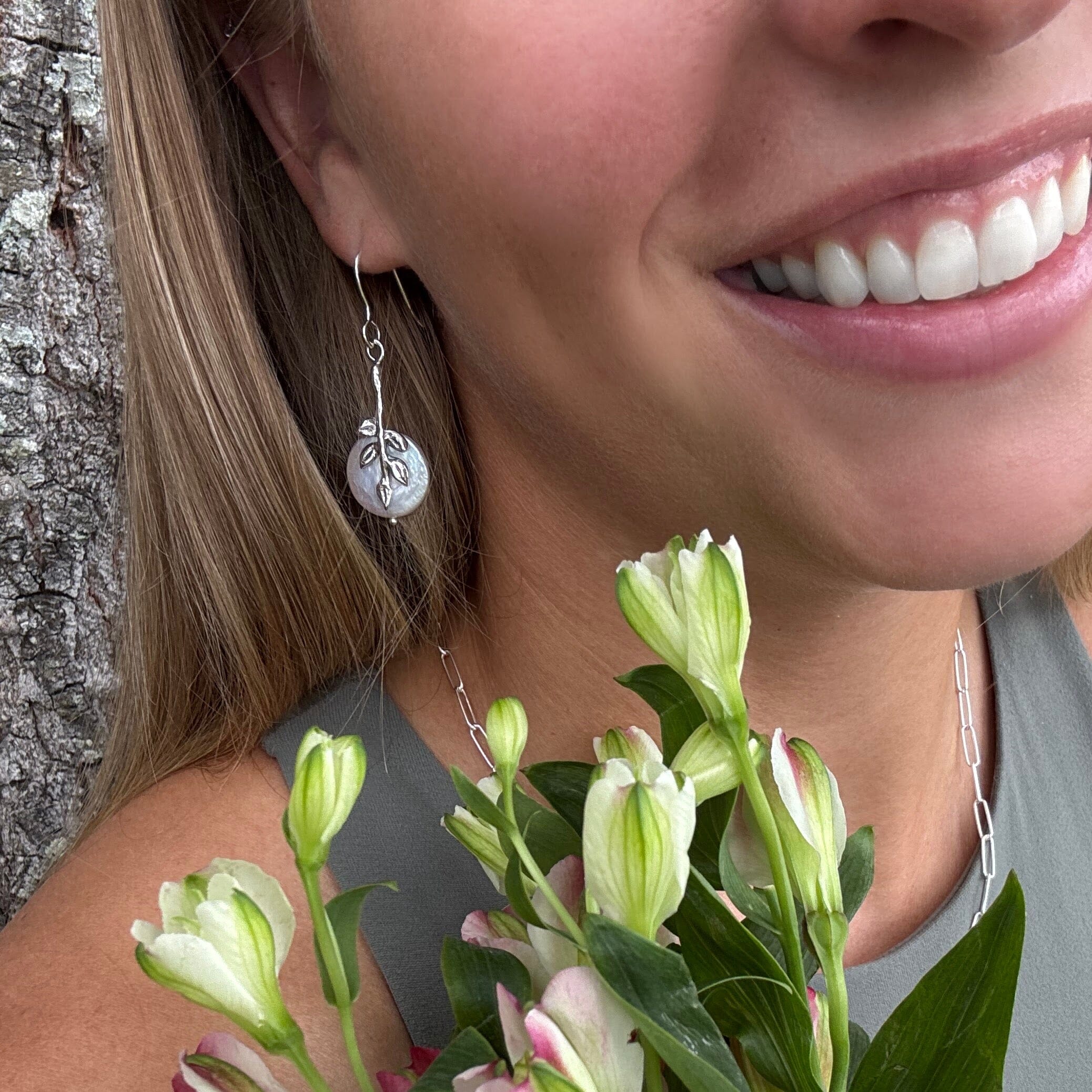 Sterling silver leaf designed dangle earring with a freshwater coin pearl
