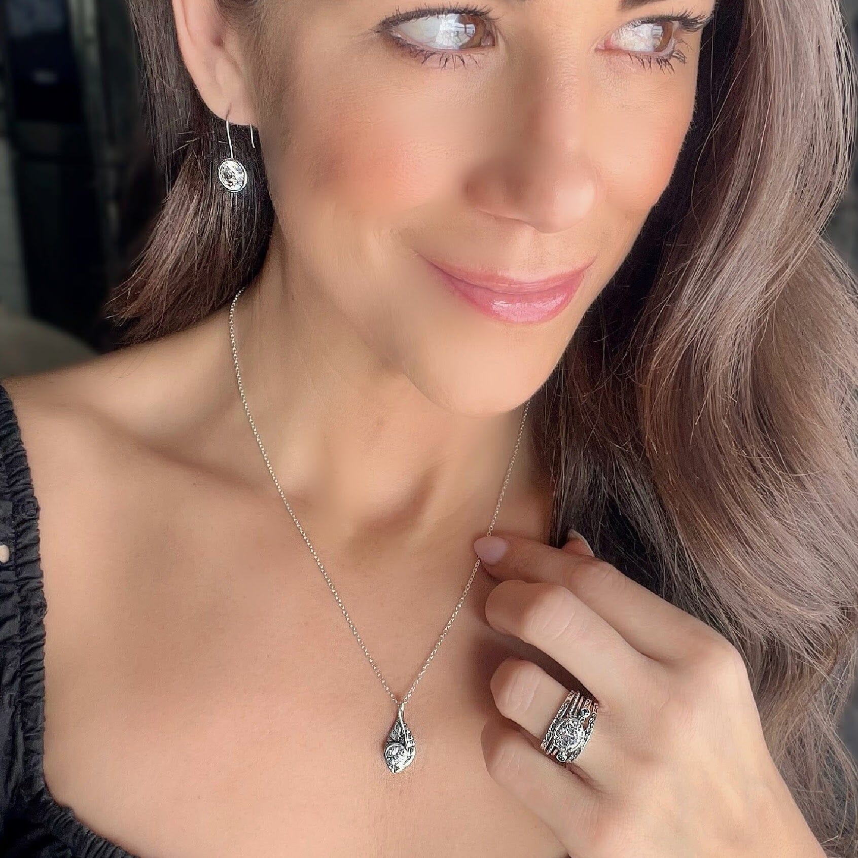 sterling silver necklace in the shape of a leaf with a cz stone on the front of the pendent, paired with the Barbados ring and showstopper earrings.