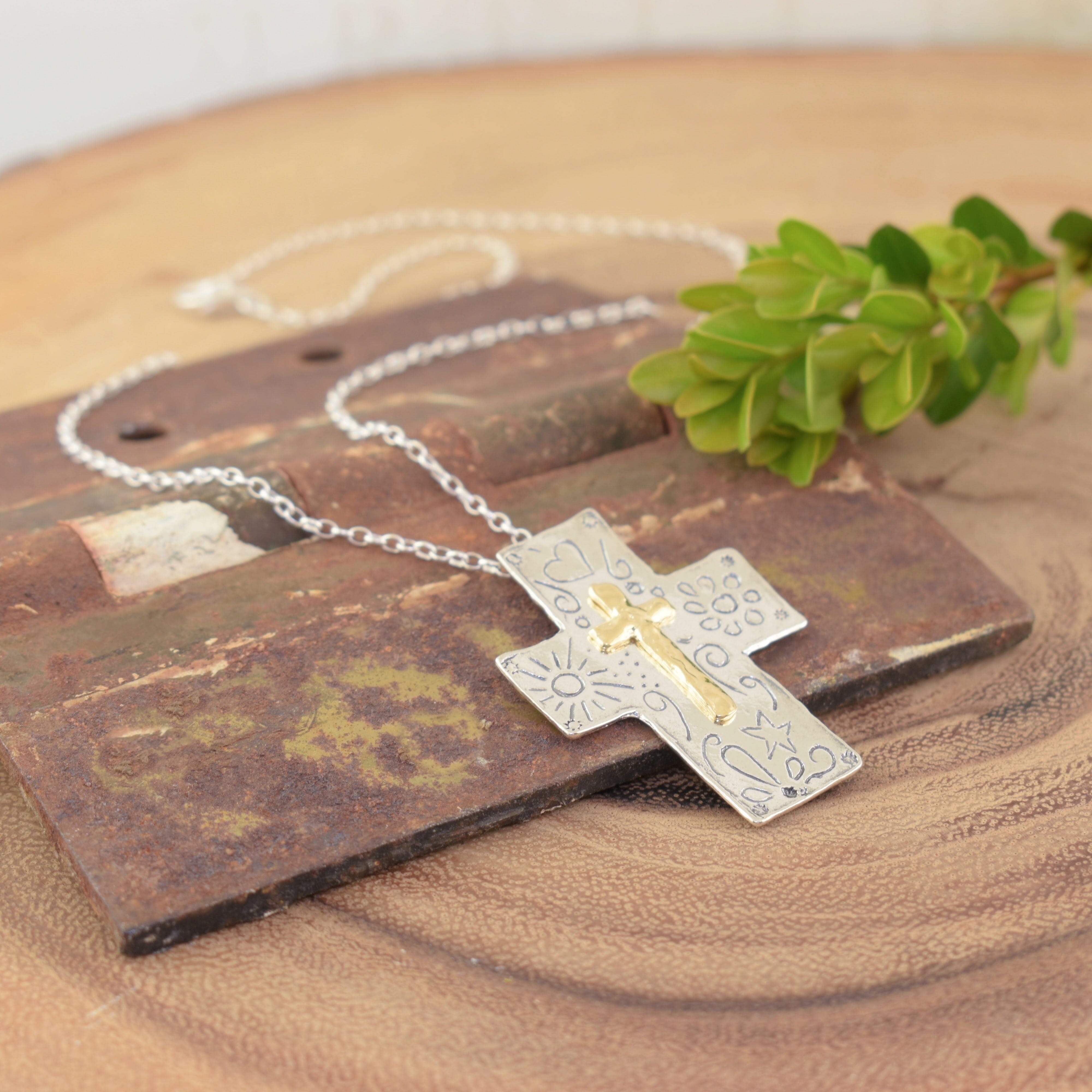 Sterling silver hand crafted cross necklace with a gold plated cross in the center