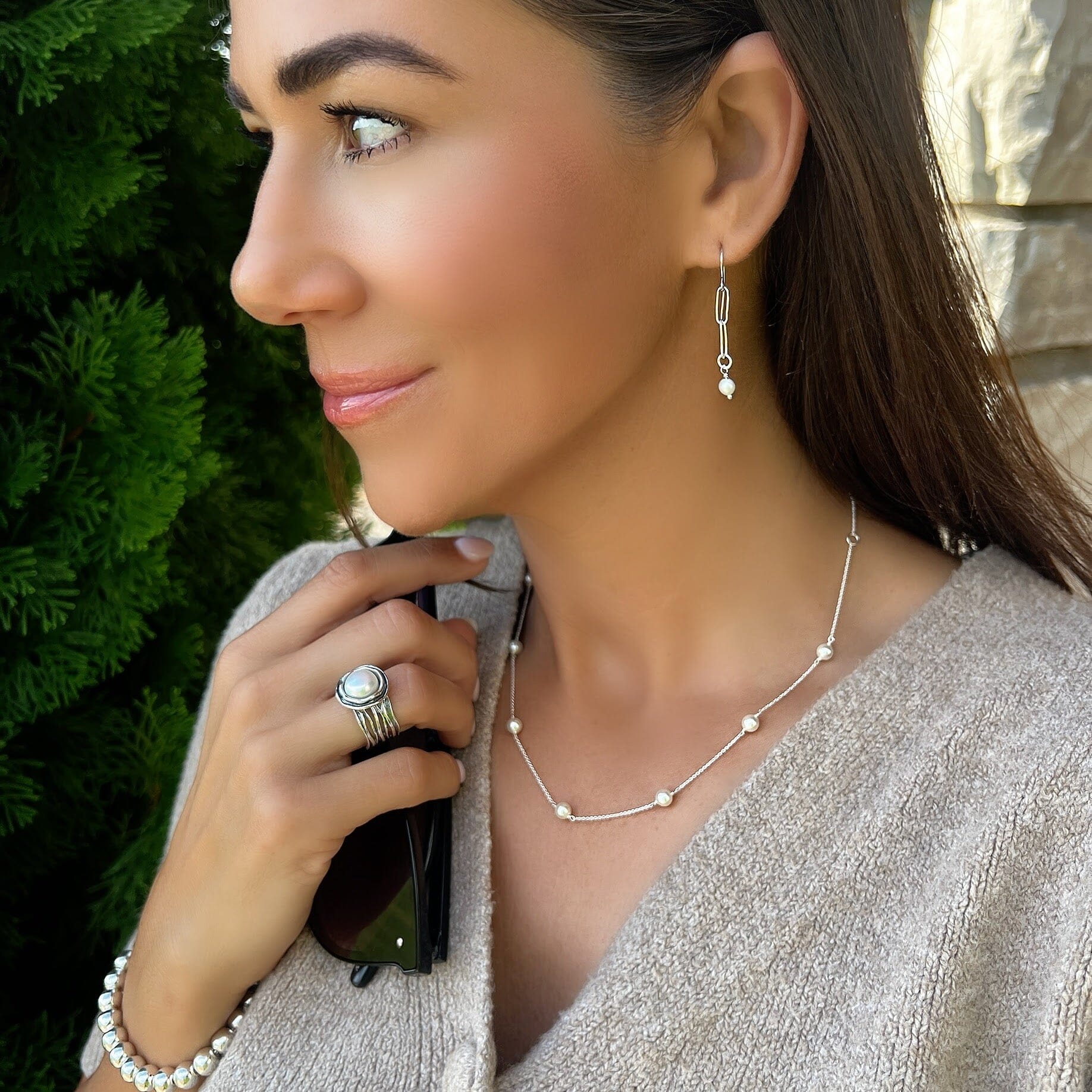 Line up earrings paired with skipping stone necklace and ella ring