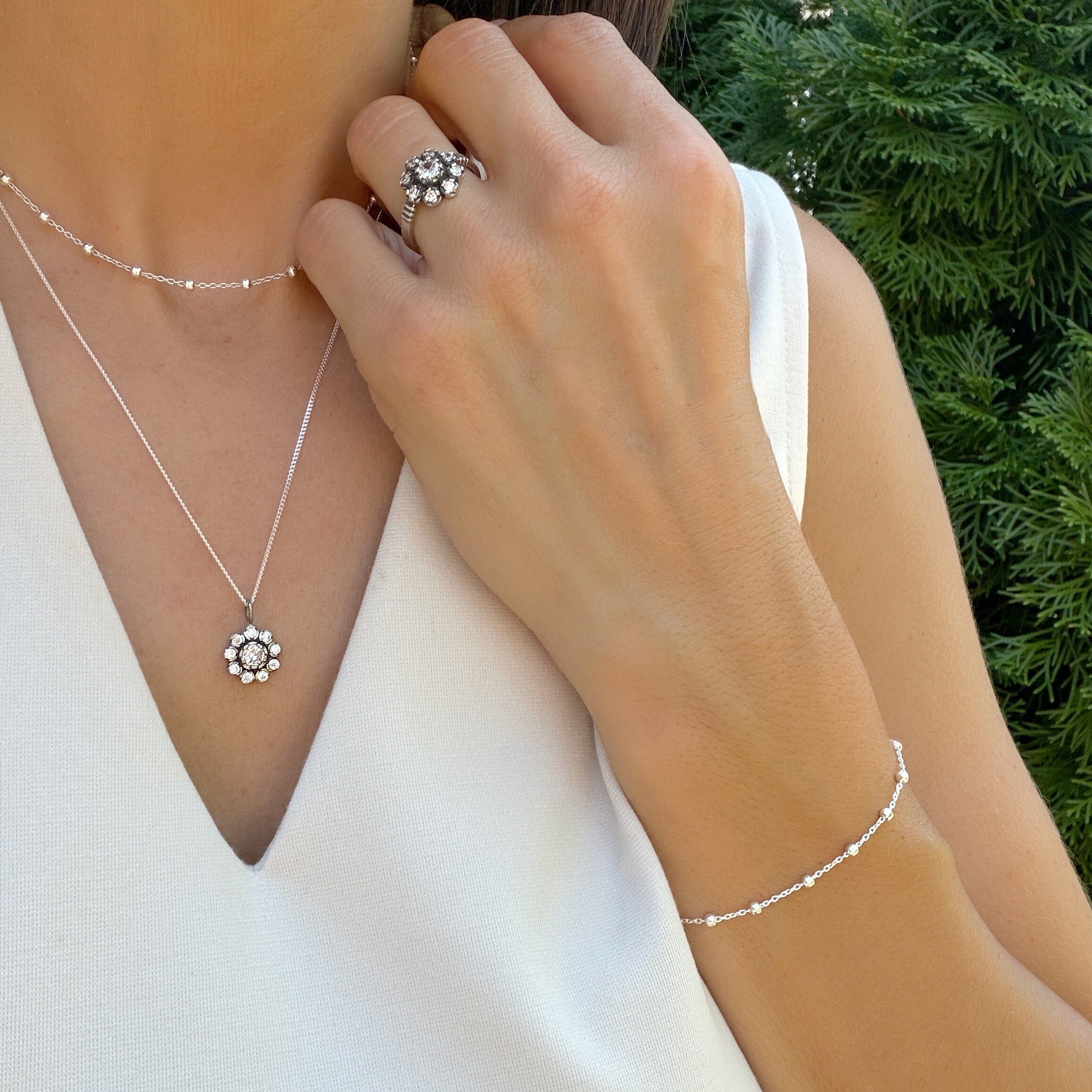 dainty bead bracelet strung together by rolo chain