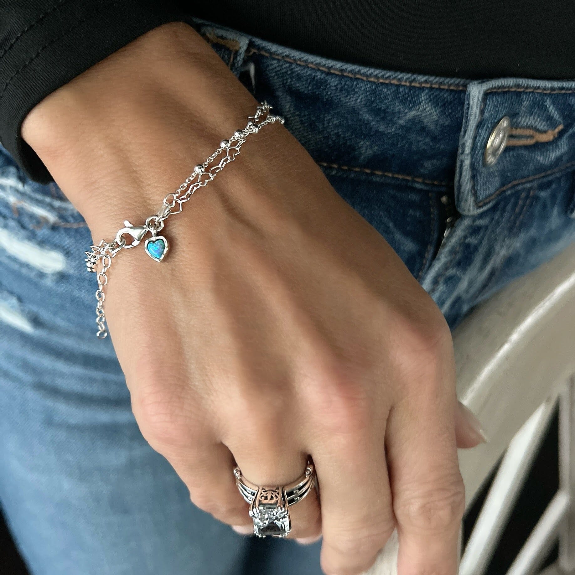 minimalist heart chain bracelet featuring  a reconstructed opal heart dangle