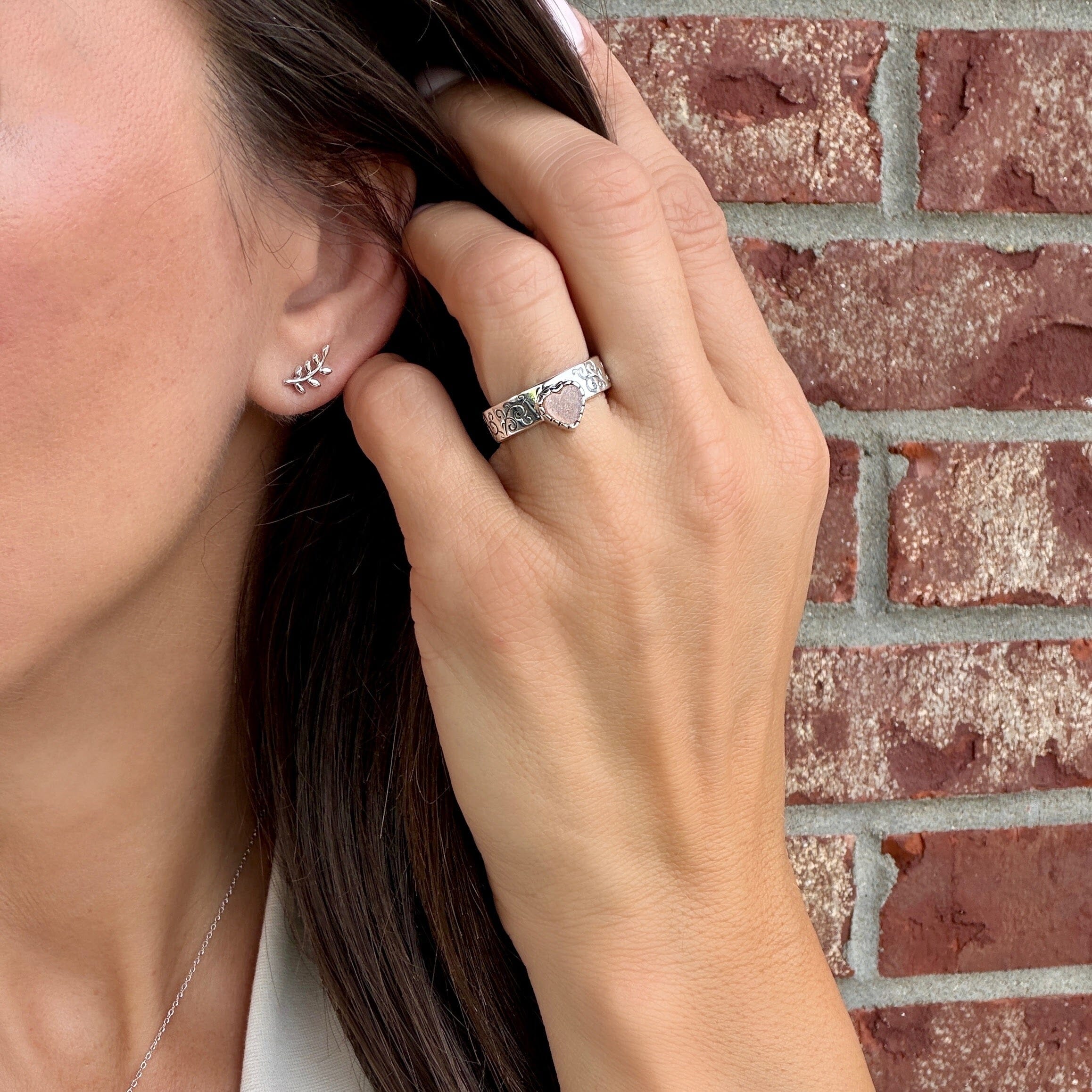 silver filigree and peach colored moonstone ring