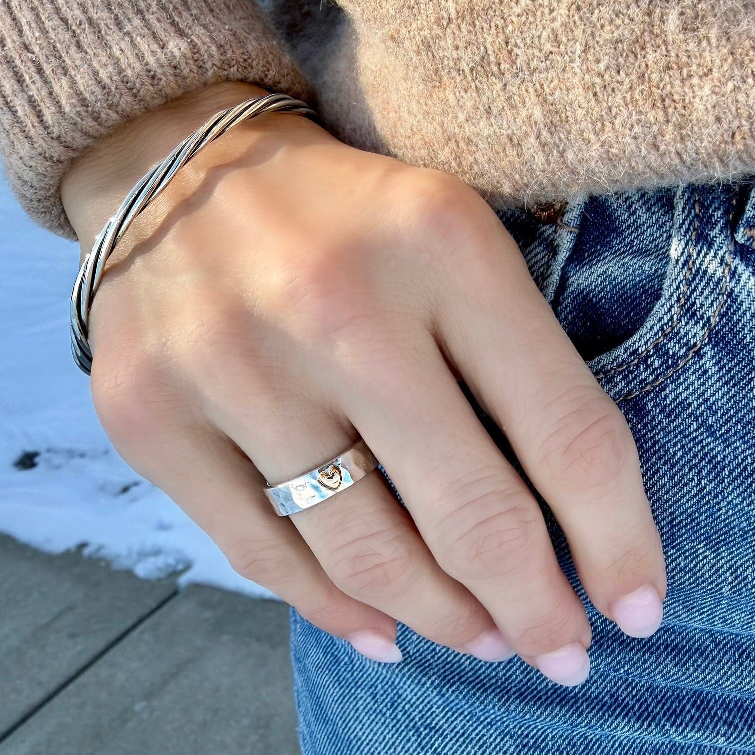 medium width hammered ring featuring a dainty heart