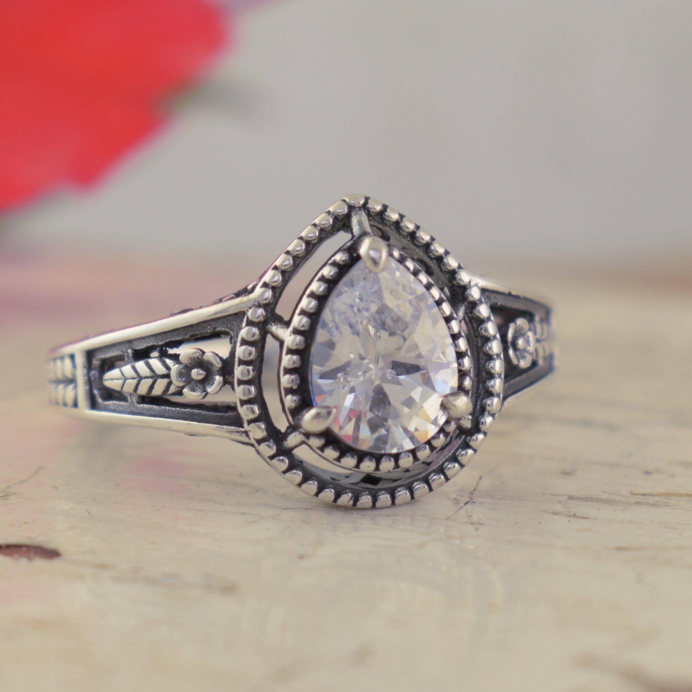 Vintage-inspired sterling silver ring with pear-shaped cbic zirconia stone