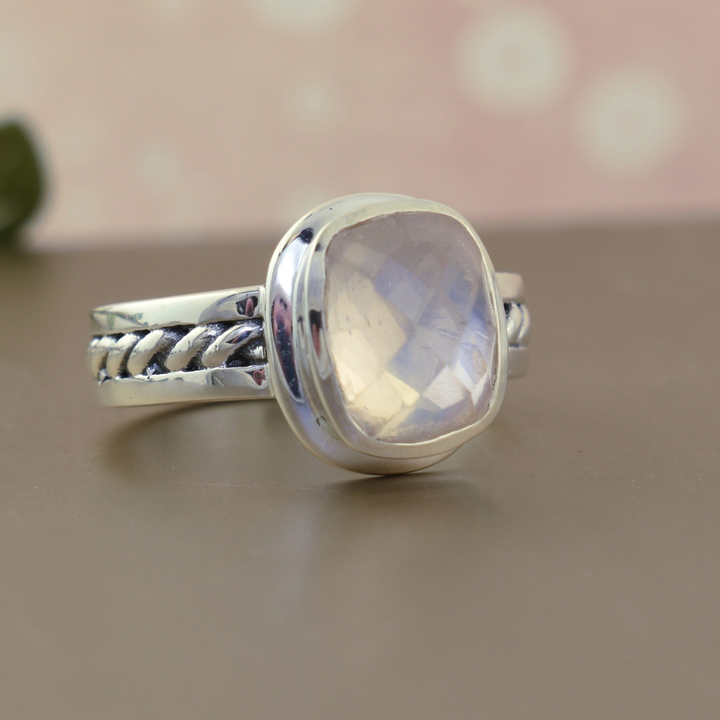 .925 sterling silver ring with hint of pink rose quartz stone