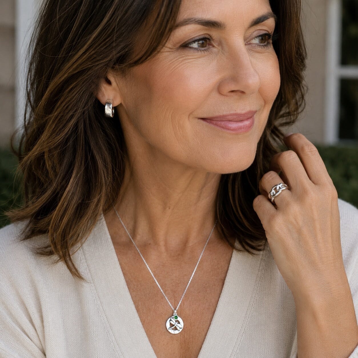 Meant to Fly necklace paired with Dust and silver hoop earrings and tied in three ring