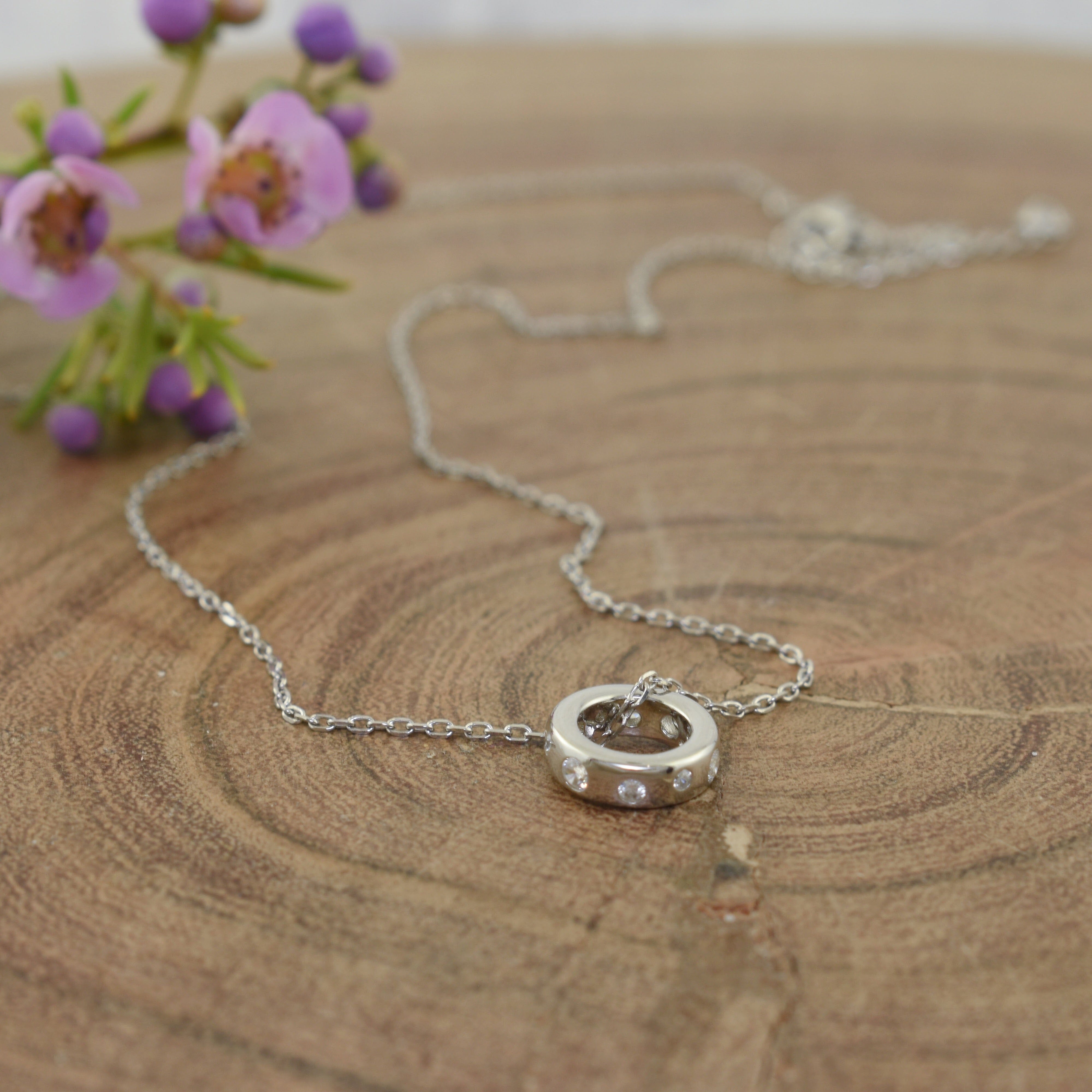 Sterling silver circle necklace with dainty CZ accents