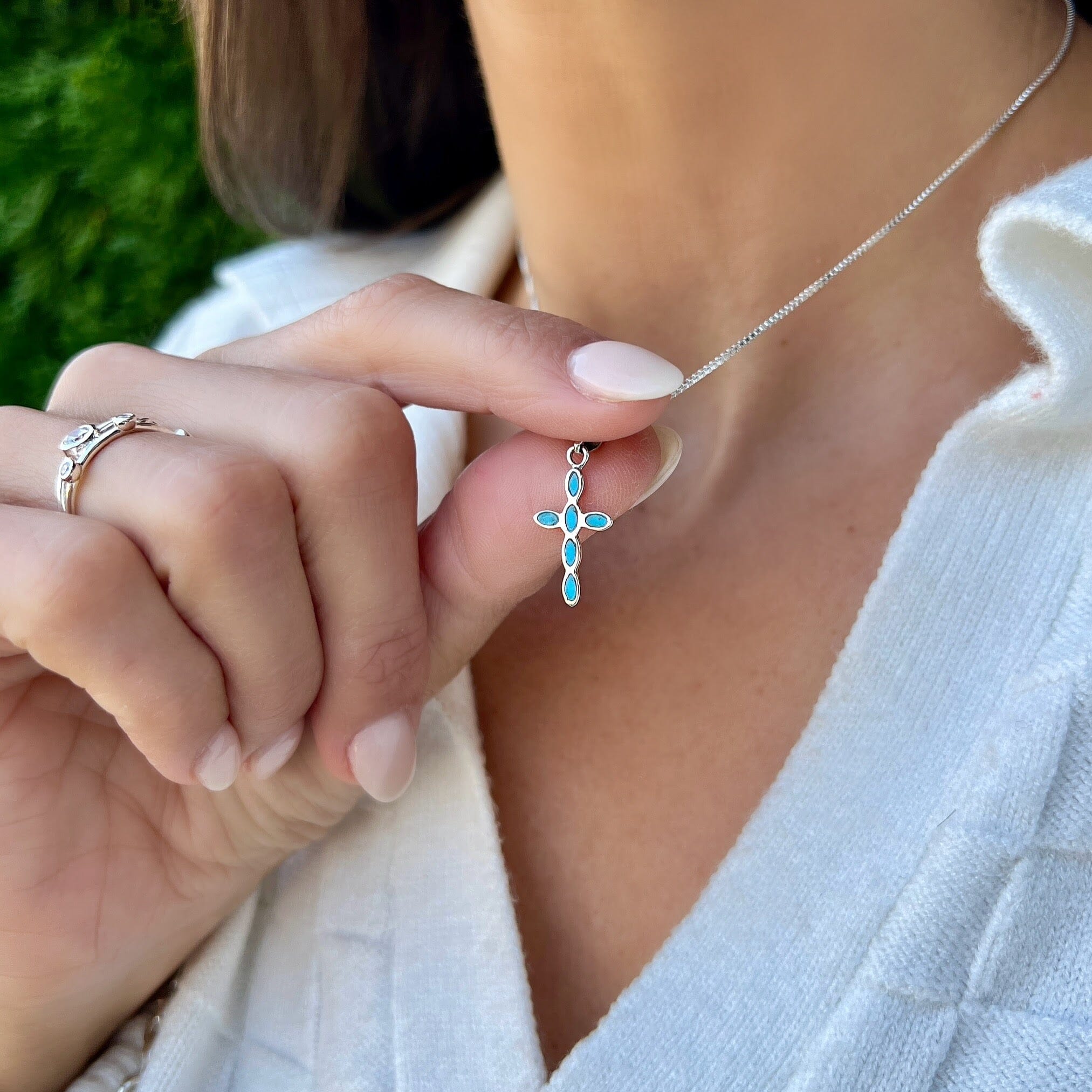 sterling siolver and turquoise colored cross necklace