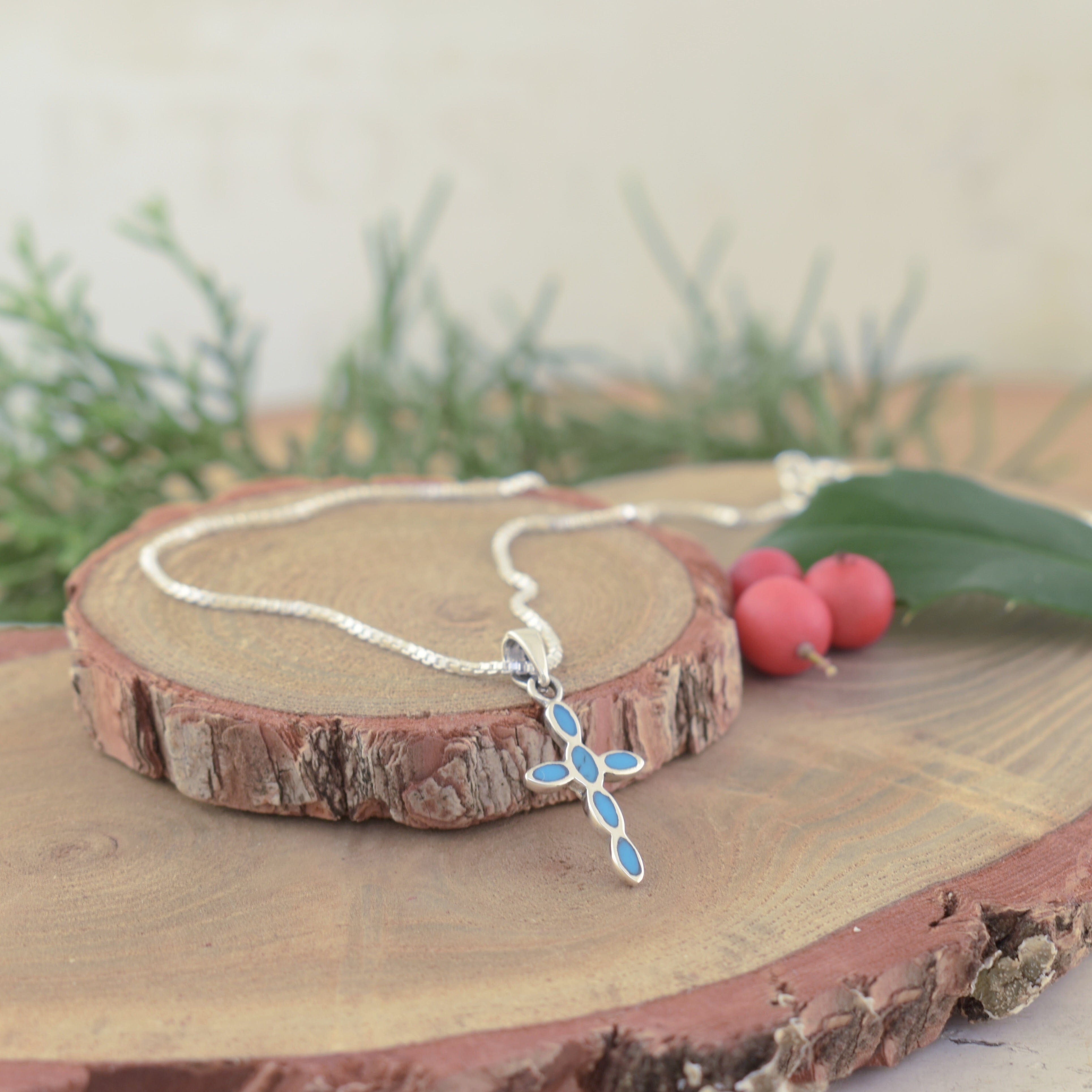 bold blue resin in a sterling silver cross