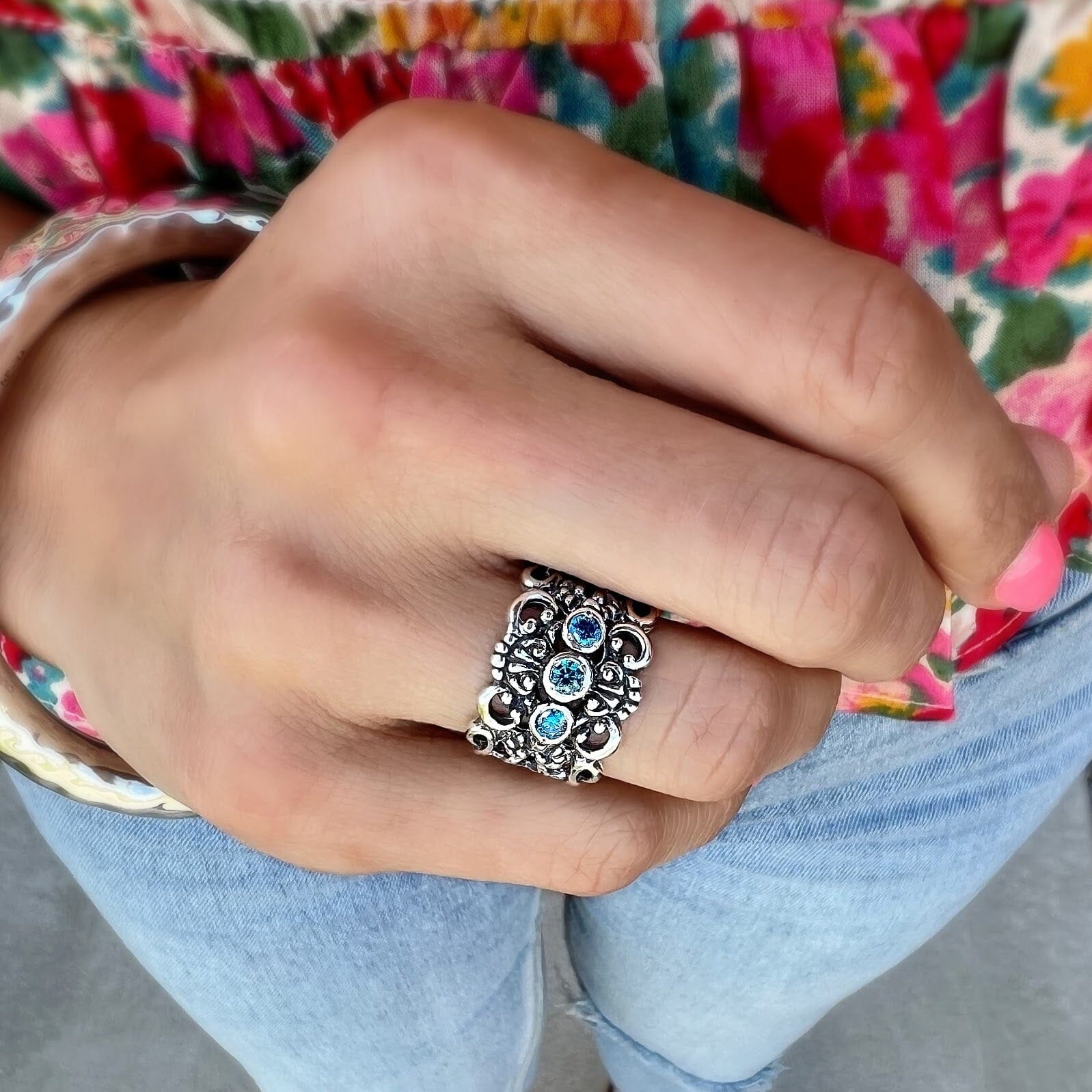 chunky sterling silver ring featuring blue cubic zirconia