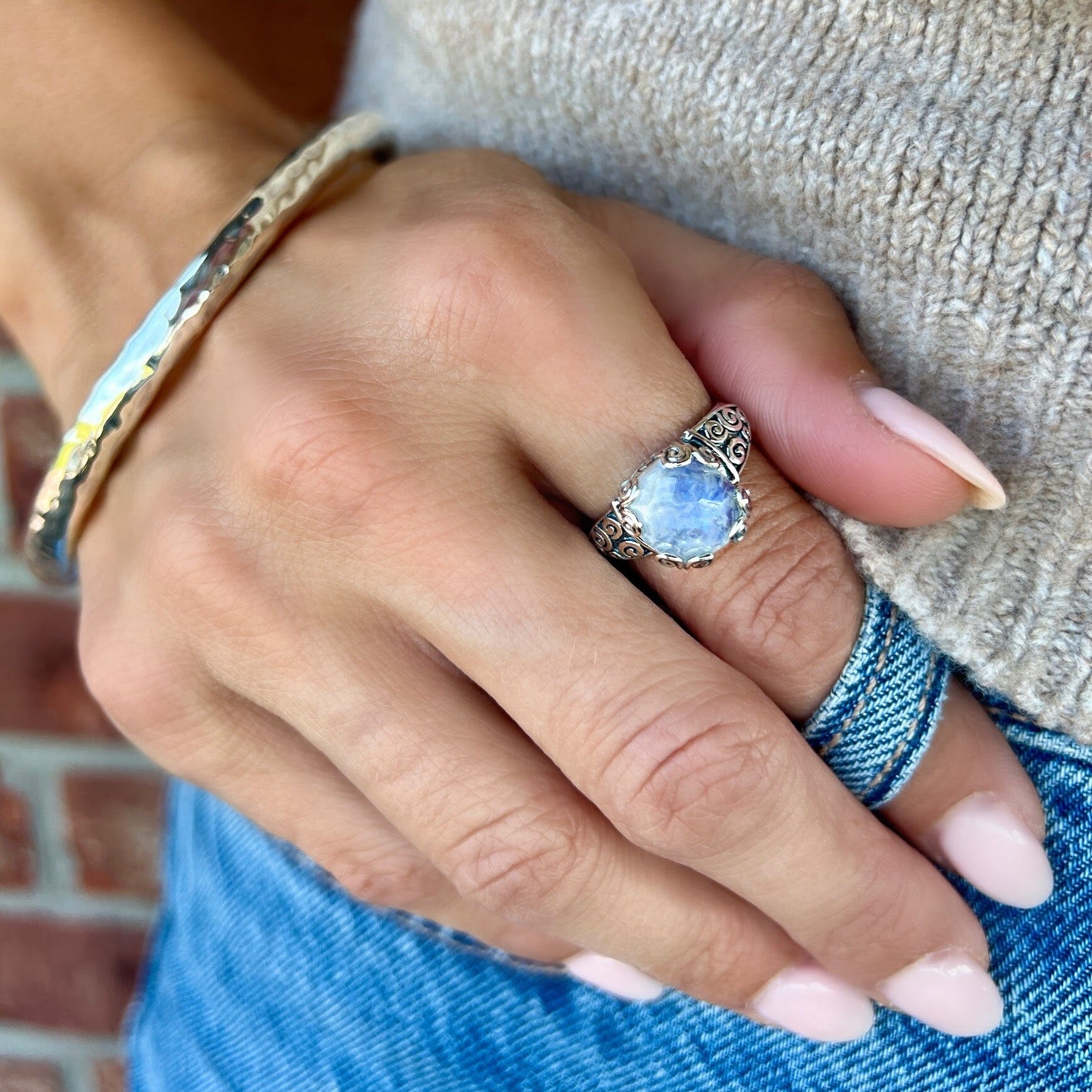 antiqued sterling silver moonstone ring featuring high polished swirls