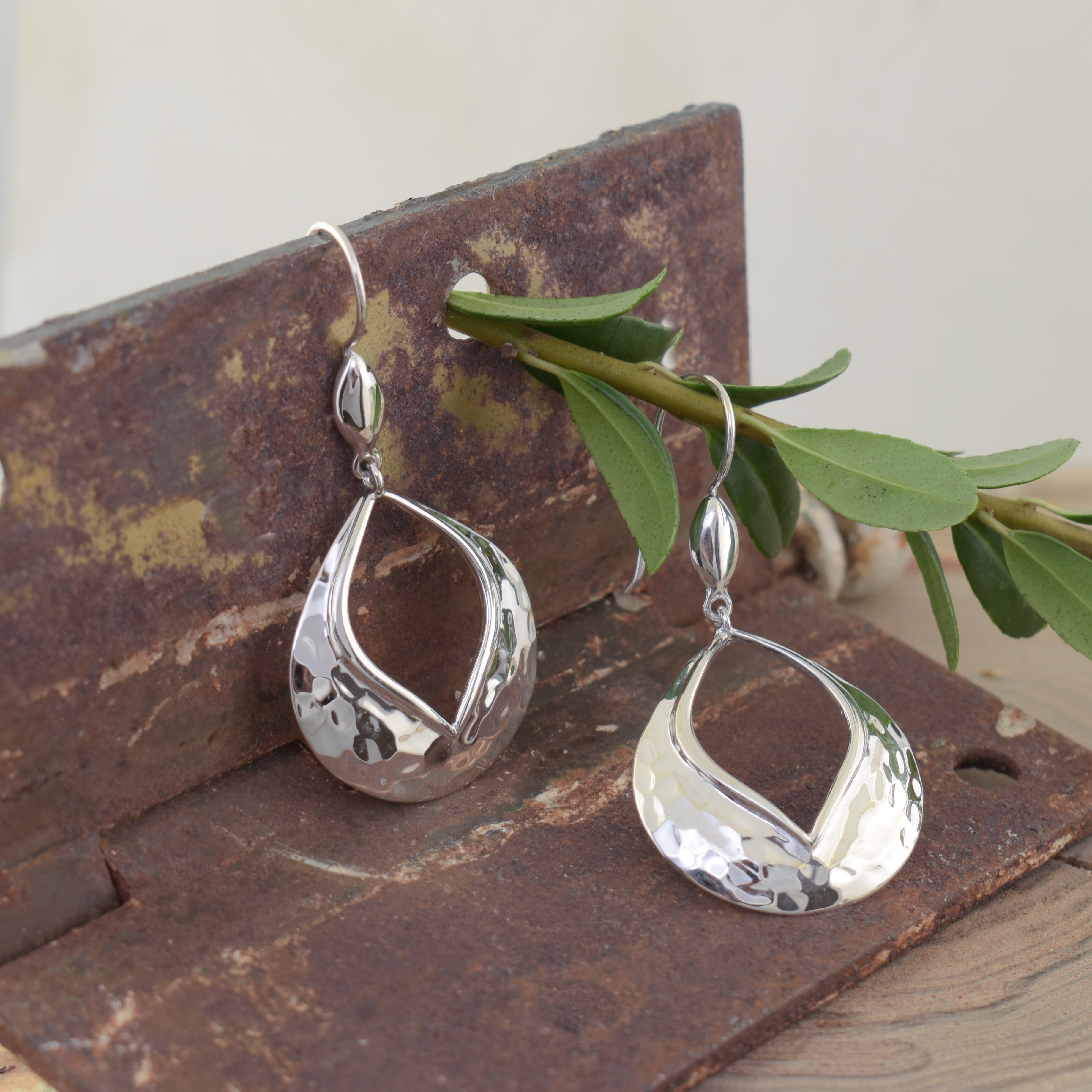 hand crafted high polished dangle earrings