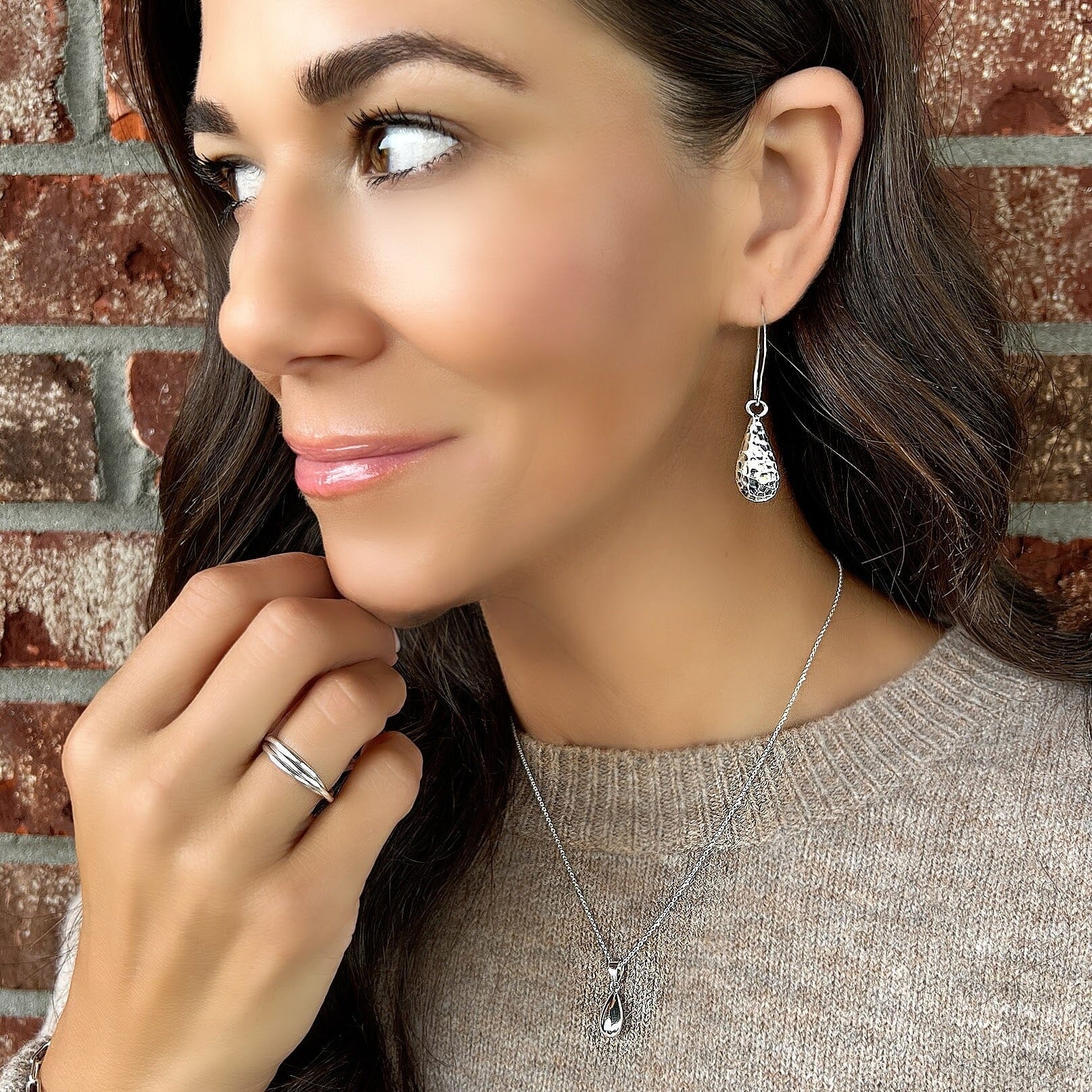 Mucho Gusto earrings paired with the bottled tears necklace and trio ring