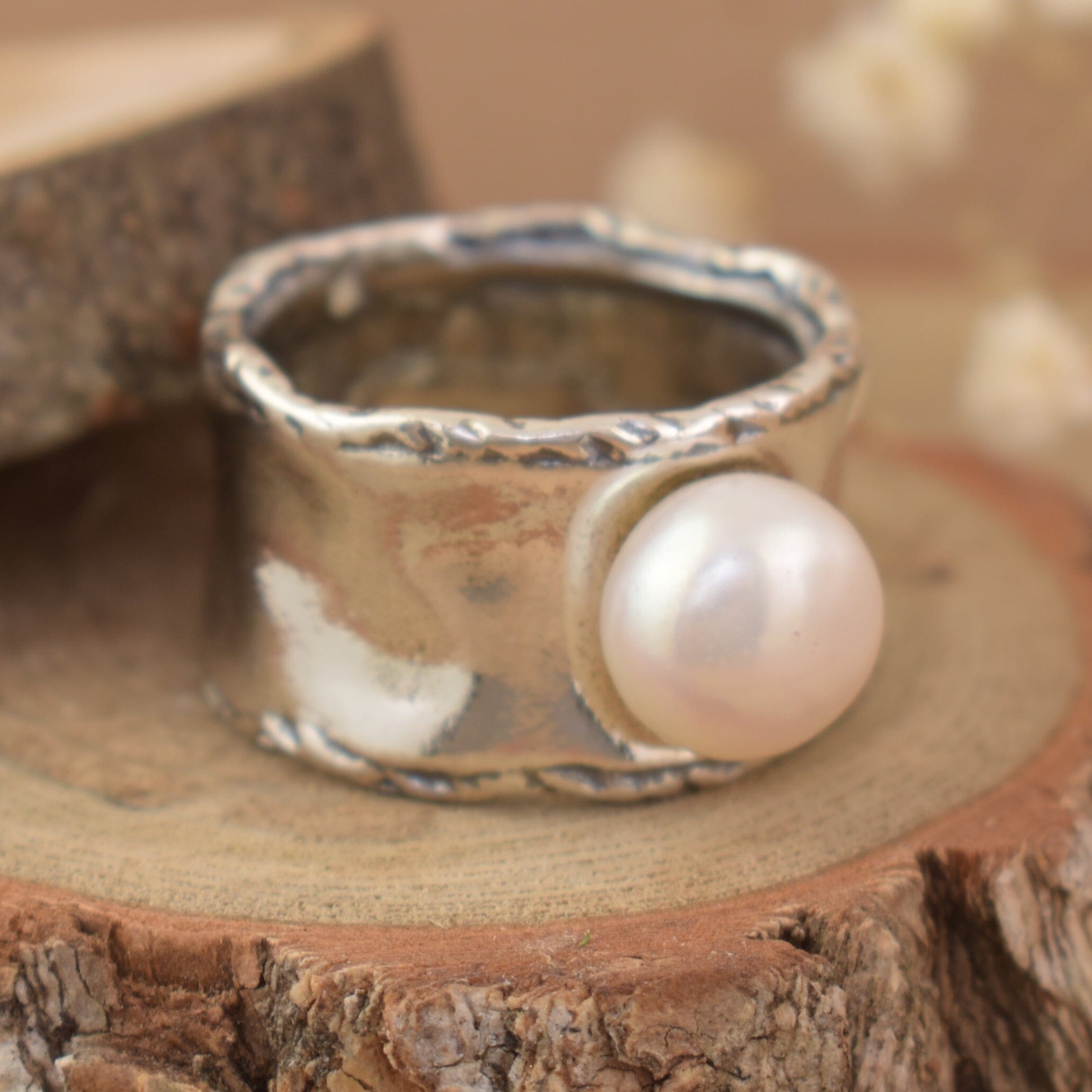 Organic sterling silver wide band style ring featuring white pearl