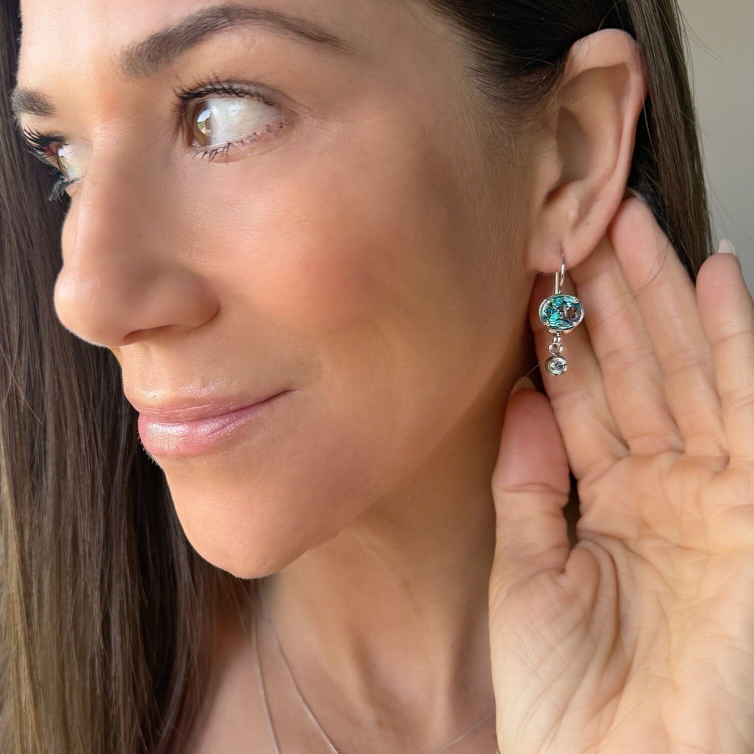 sterling silver earrings featuring blue and clear cz