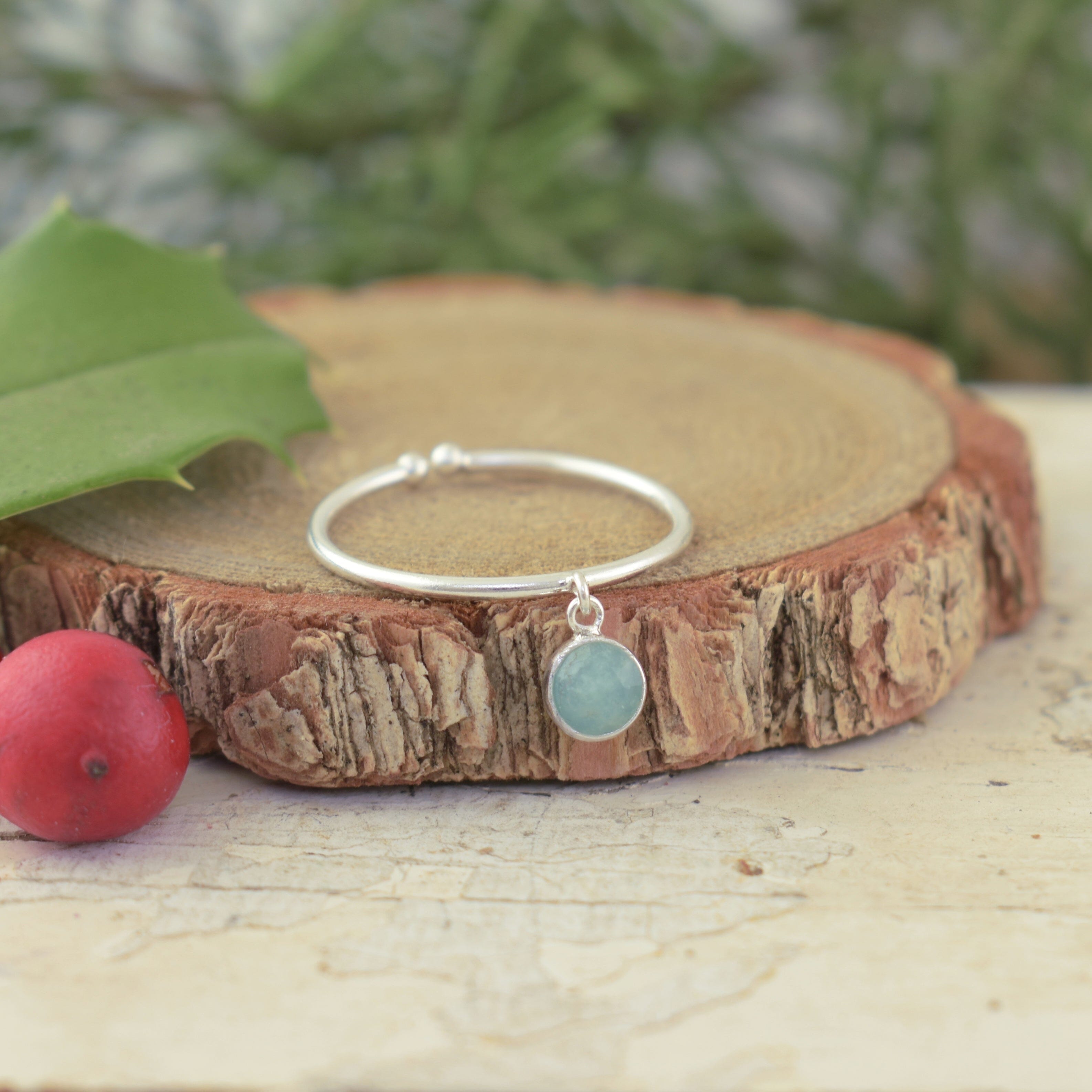 Sterling silver adjustable ring with a dangle stone