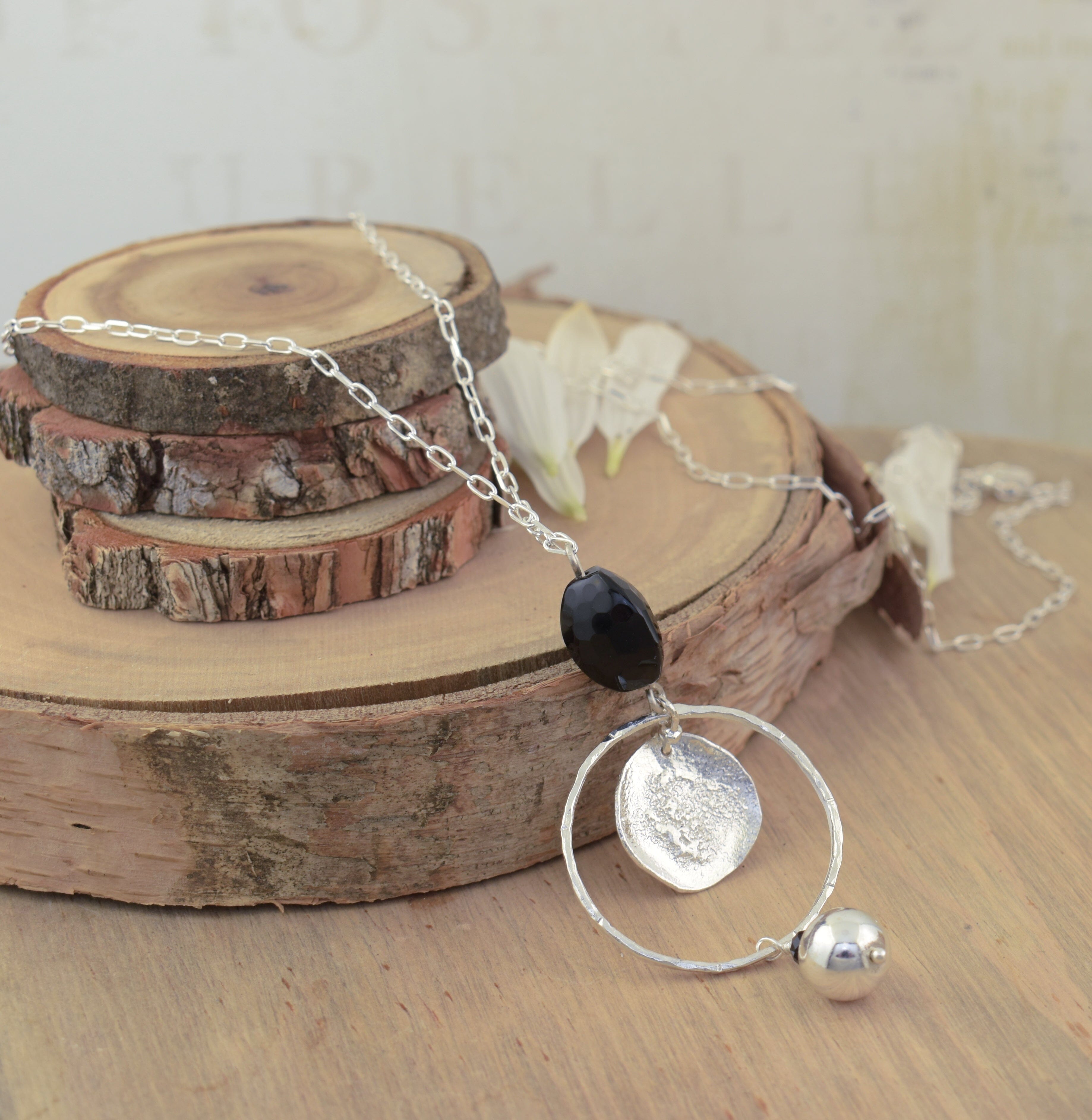 long statement necklace featuring sterling silver, hematite, and agate